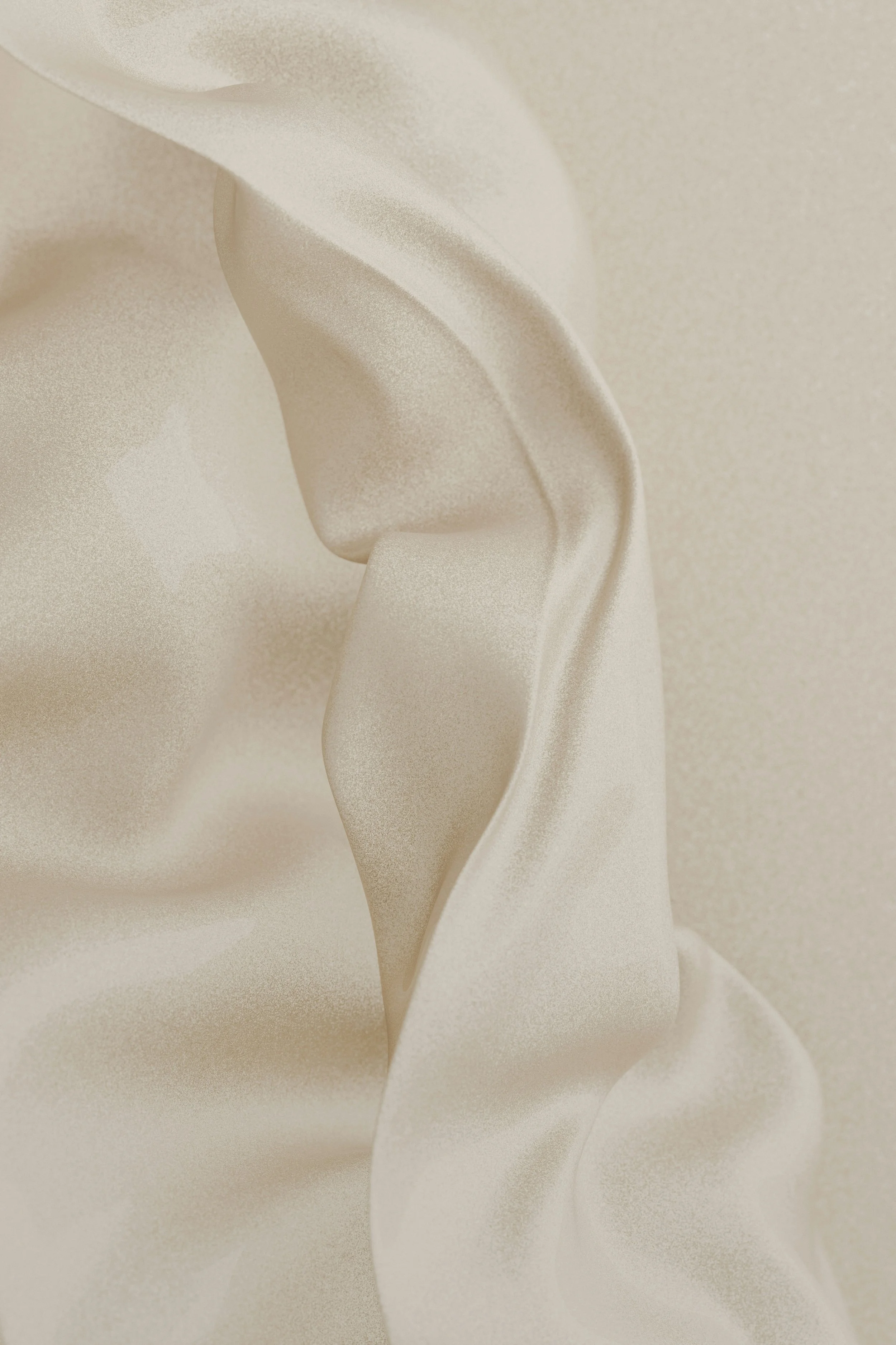 Close-up of soft, flowing, beige satin fabric with gentle folds and smooth texture.