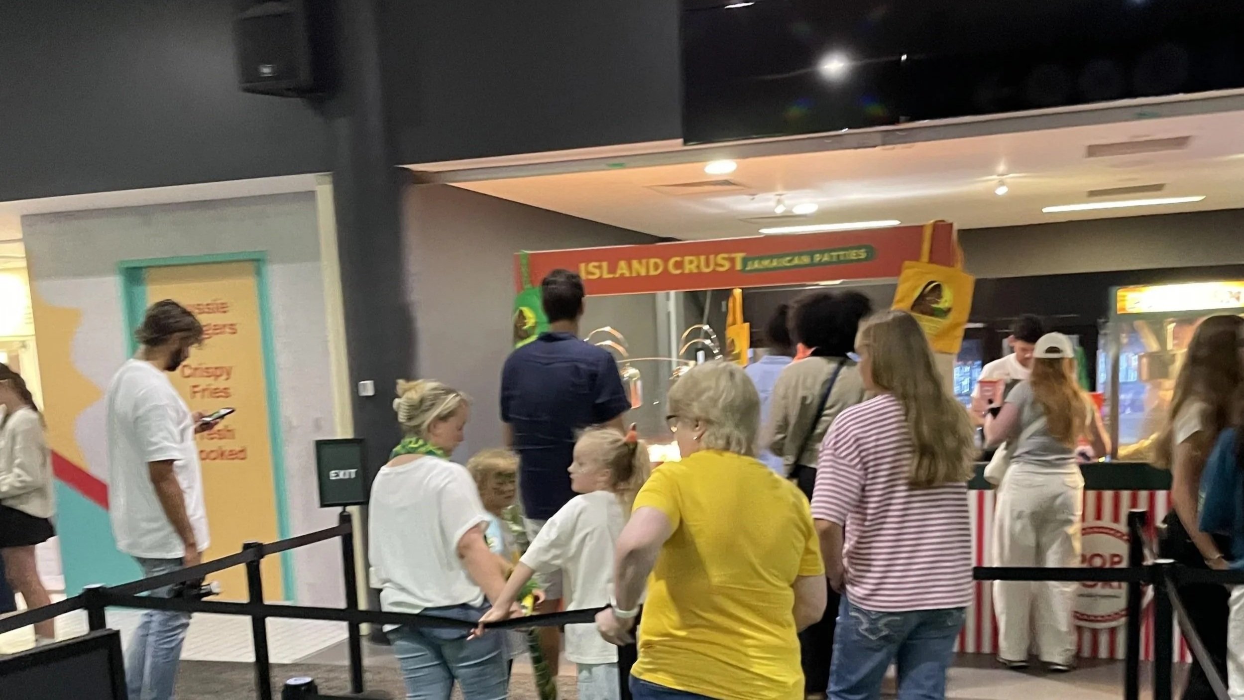 People standing in line at 'Island Crust Jamaica's Patties' at Melbourne Park