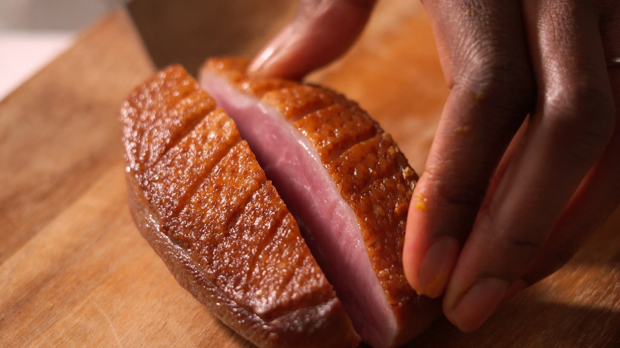 Chef May slicing duck