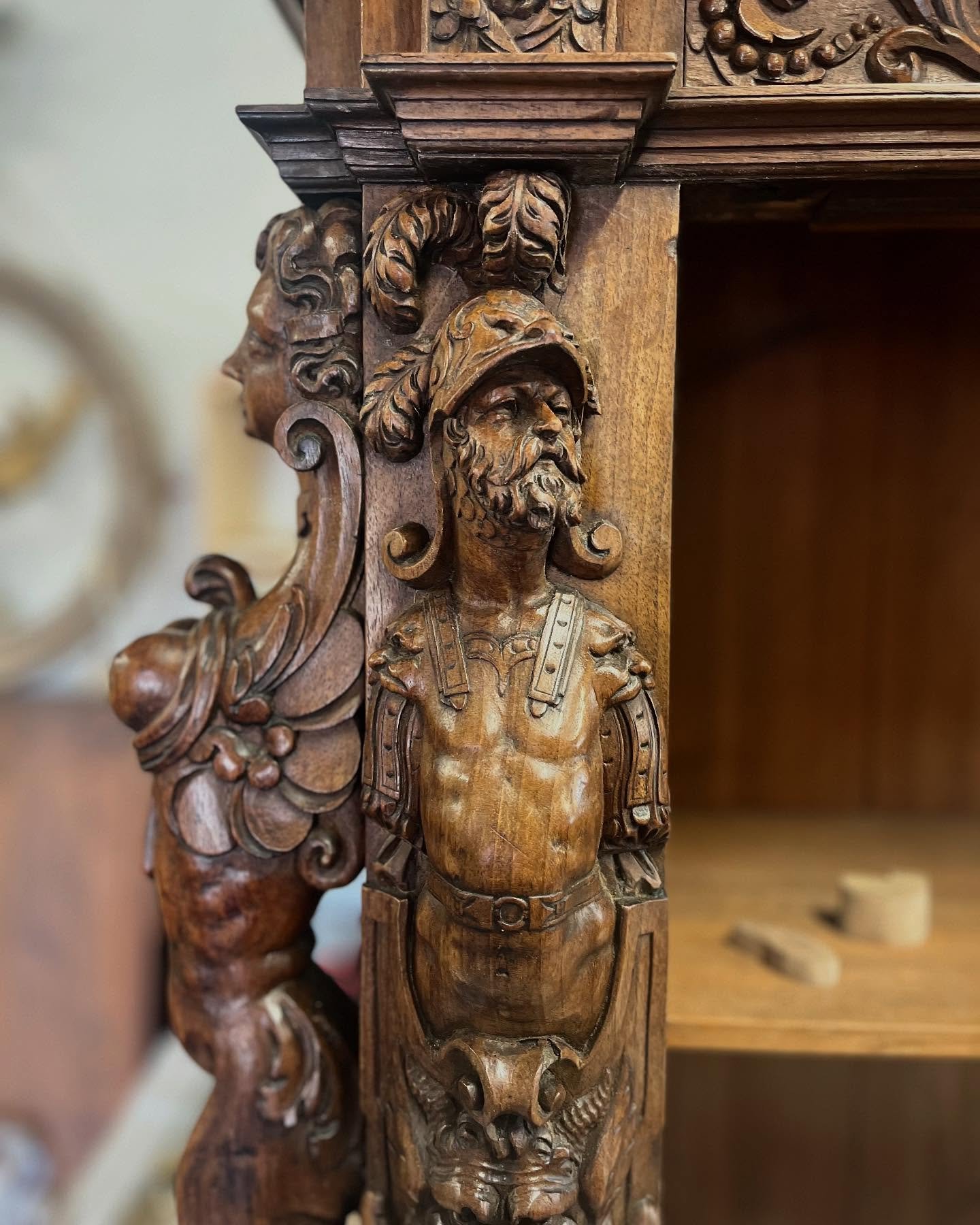 Every carving tells a story.
One of the real pleasures of working on this magnificent 17th-century cabinet is taking the time to appreciate the extraordinary carving that might otherwise be overlooked.
An armoured warrior stands proudly on the corner