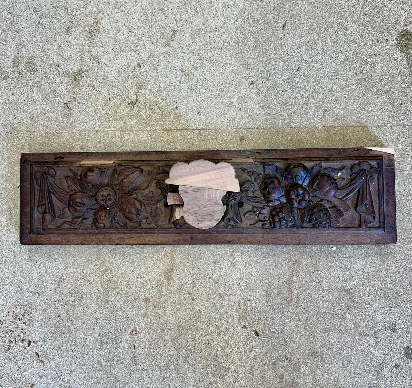 &ldquo;When an antique has lost its face... you carve it a new one.&rdquo; A satisfying before &amp; after.
This beautifully carved draw had lost its original central face over the years, leaving an obvious gap in the decoration.
Using the surviving 