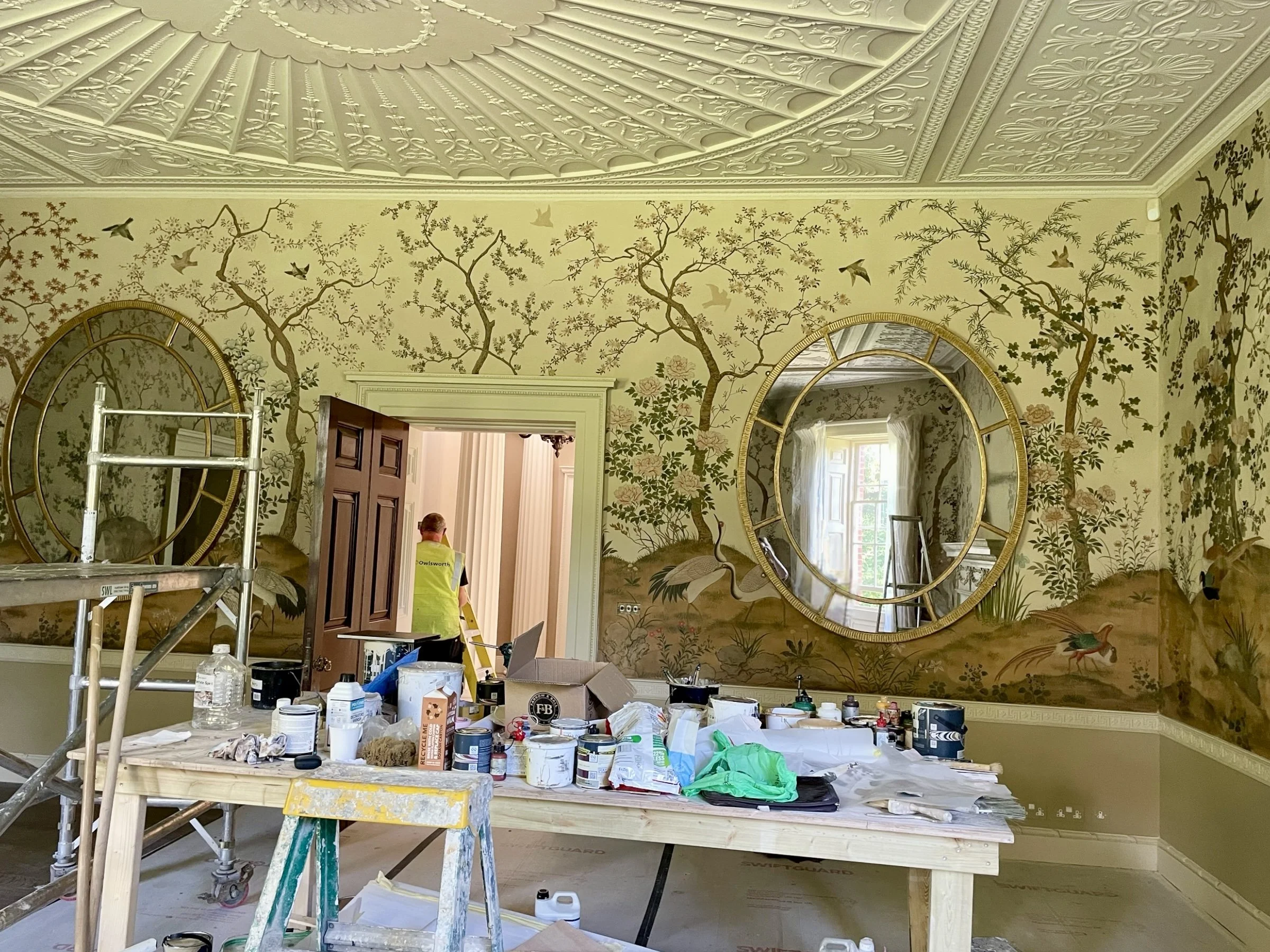 Pair custom built gilded oval mirrors