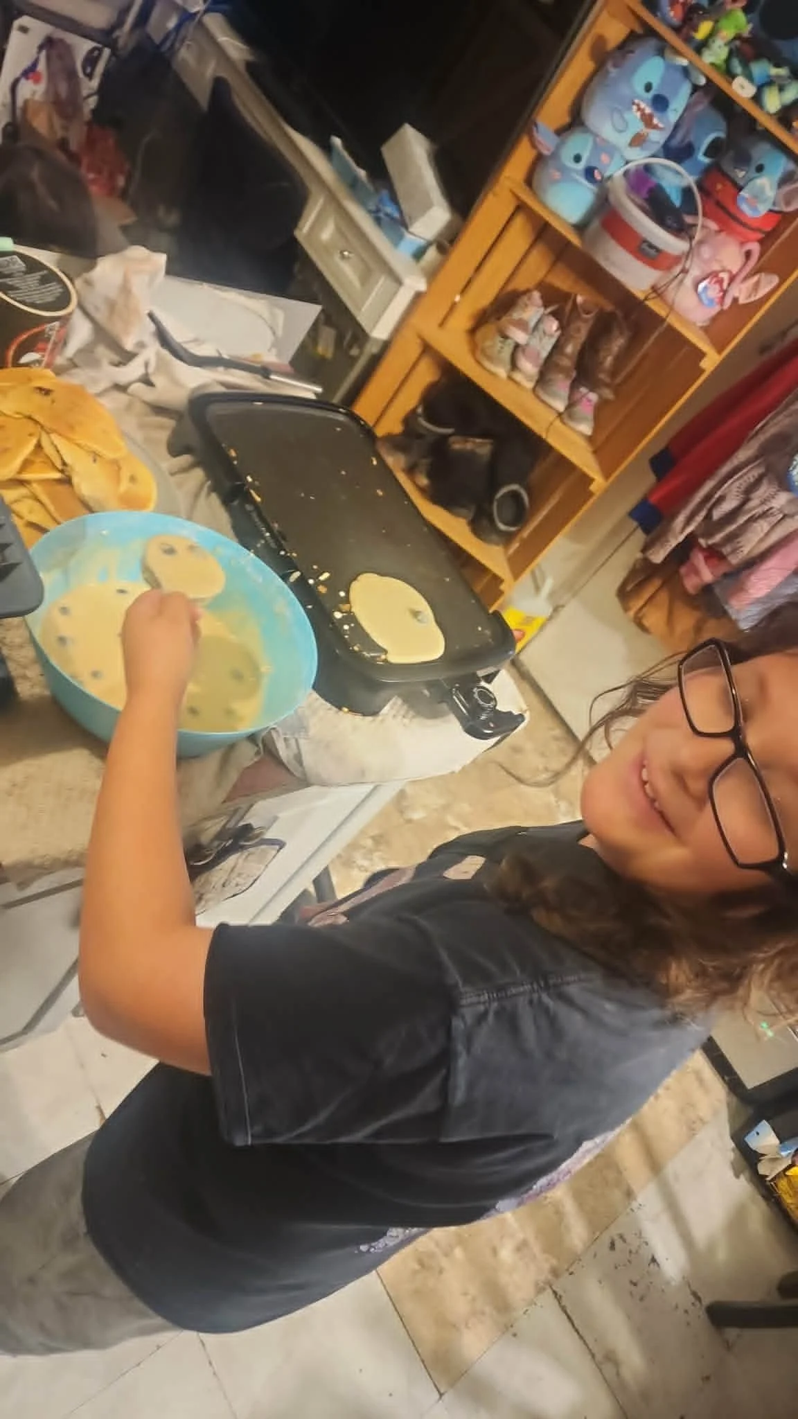Child making pancakes during a Heathen Farms family meal