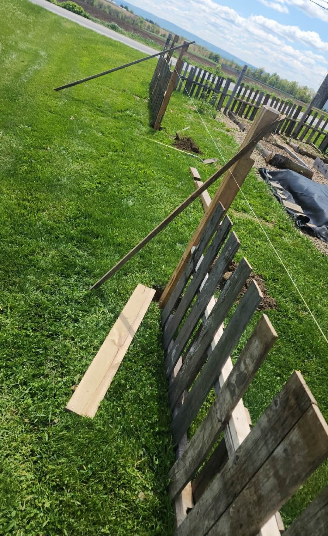 Reclaimed pallet fence under construction at Heathen Farms in Newburg, Pennsylvania