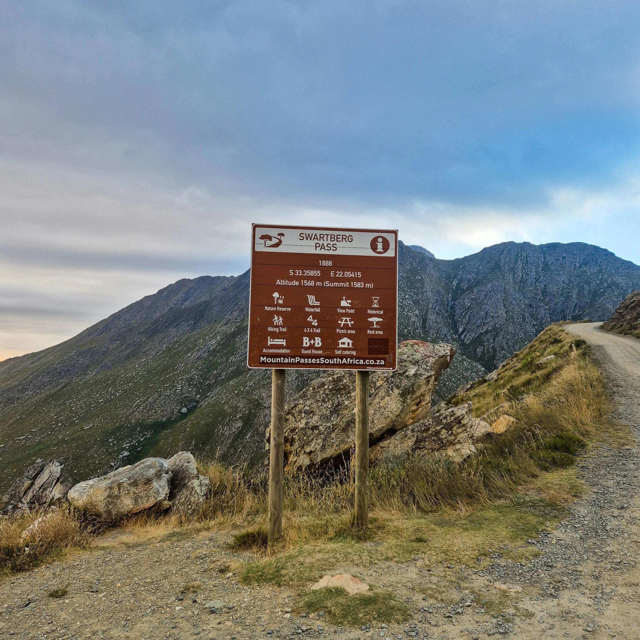 swartberg pass road sign mountain pass suggestions for motorcyclists South Africa