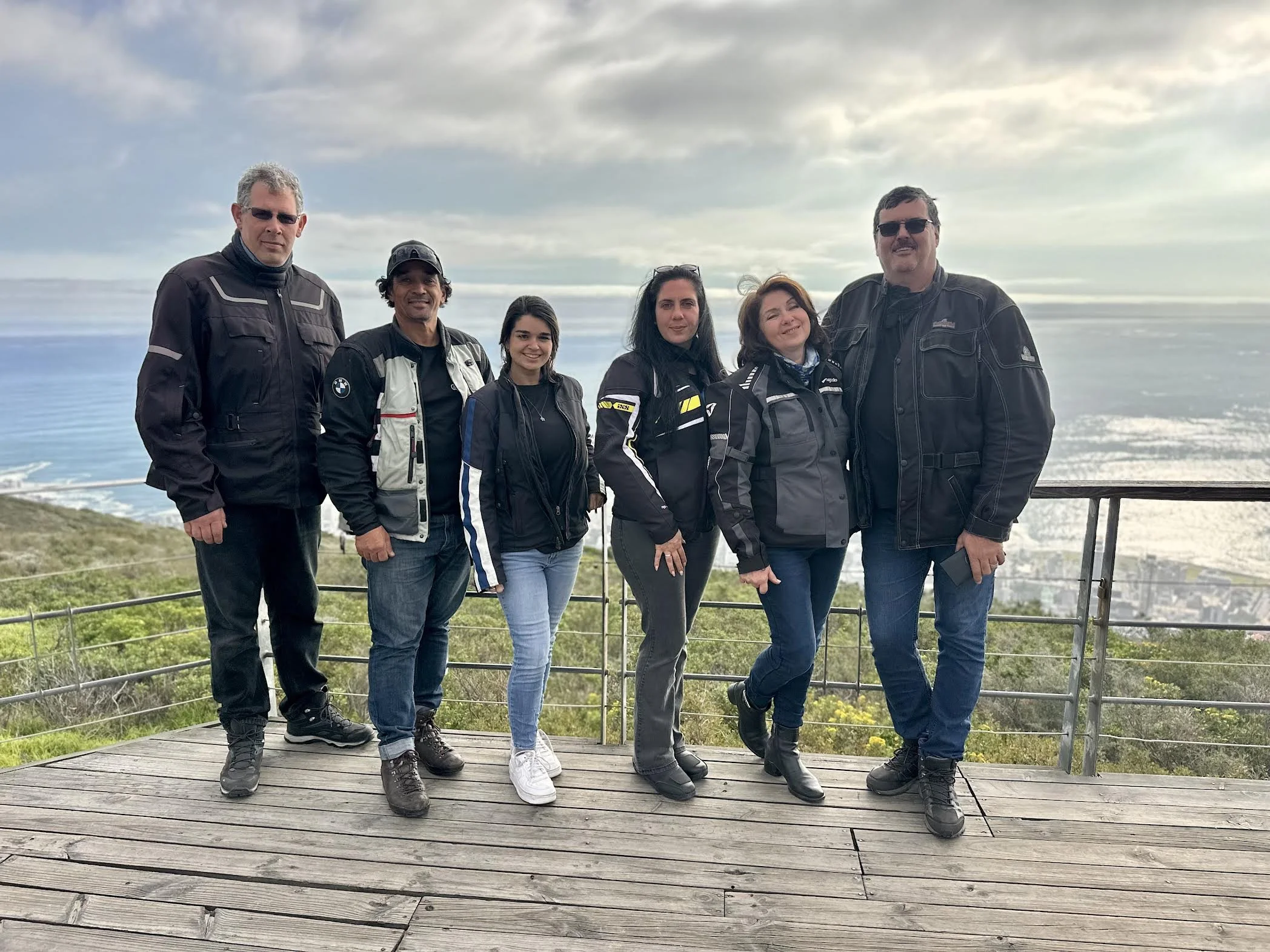 Altitude Adventure motorcycle tour crew standing at signal hill overlooking seapoint in Cape Town South Africa