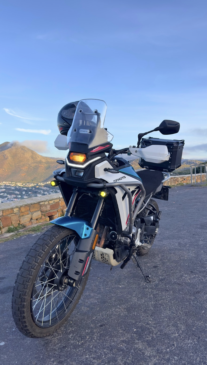CFMOTO 450MT adventure motorcycle rental on Redhill overlooking Simon's Town, Cape Town