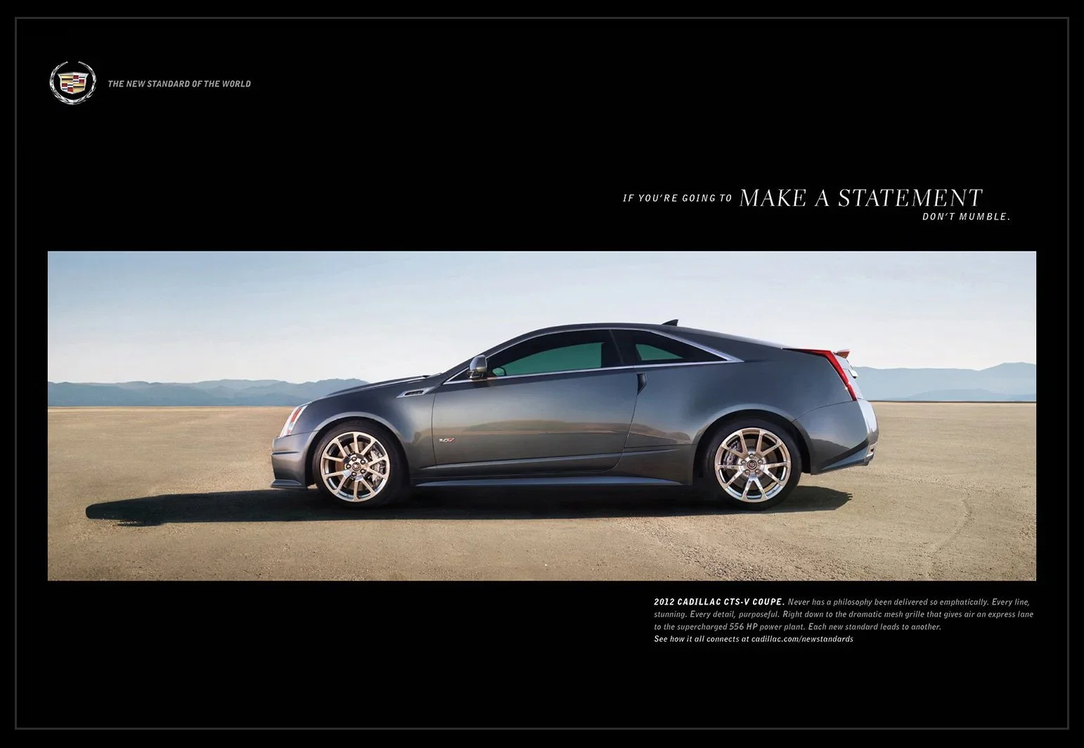 A 2012 Cadillac CTS-V Coupe parked on a flat landscape with mountains in the background.
