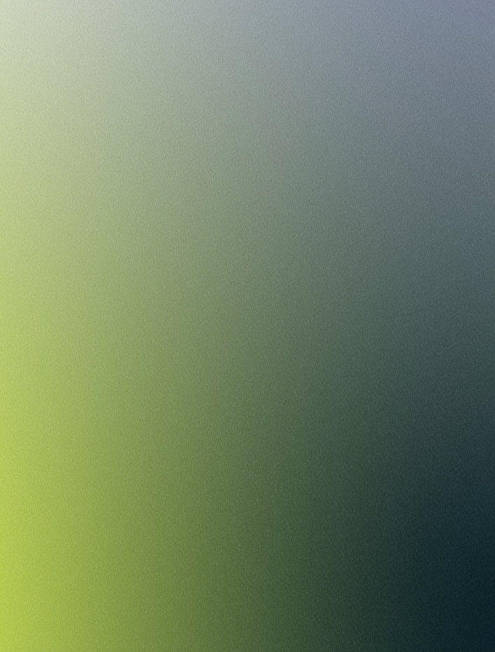 A blurred image with shades of green, gray, and blue, making it difficult to identify specific objects or details.