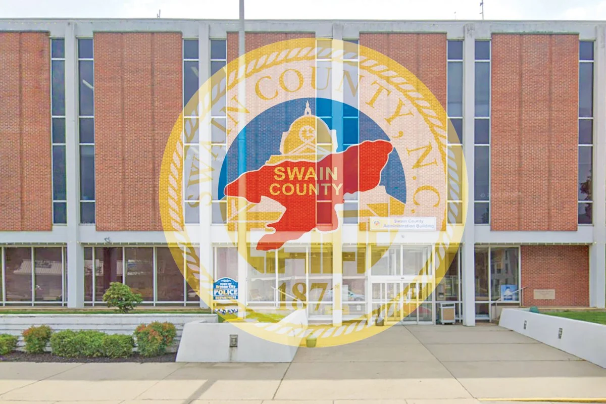 The Swain County government building with the county seal overlaid in the foreground.