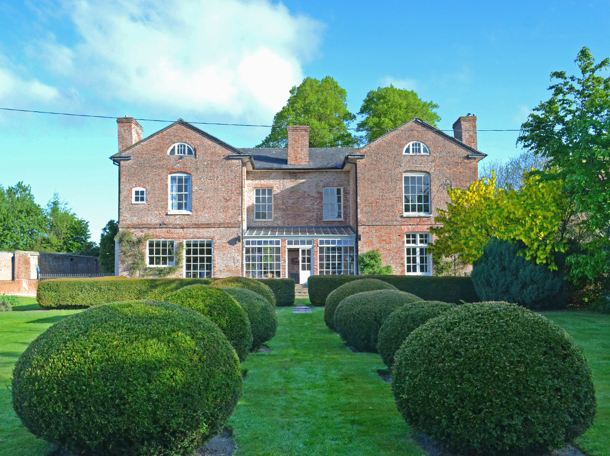 Bedfordshire large family garden with lawn and topiary hedge shrub