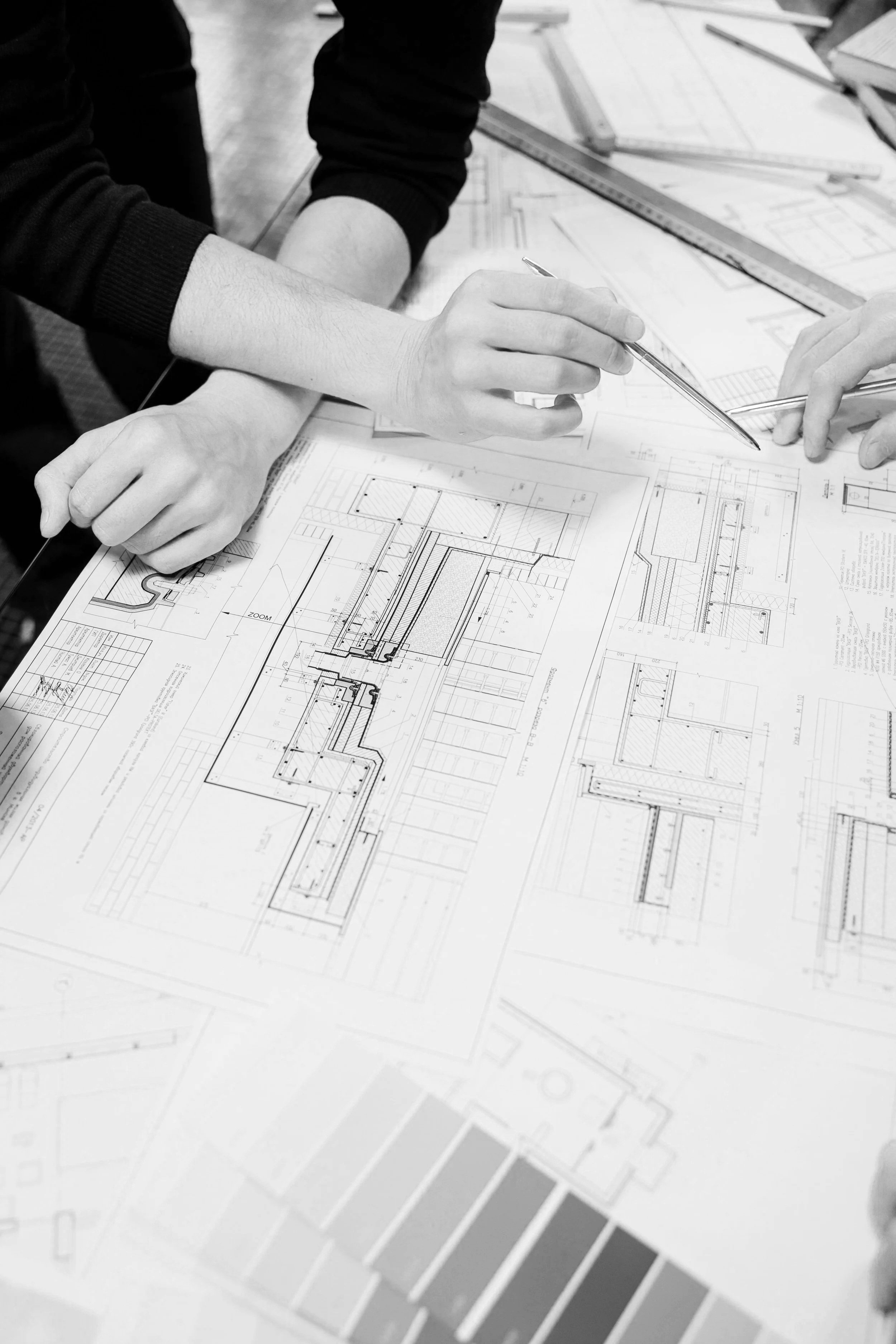 Technical landscape design drawings being reviewed during the garden construction planning stage.