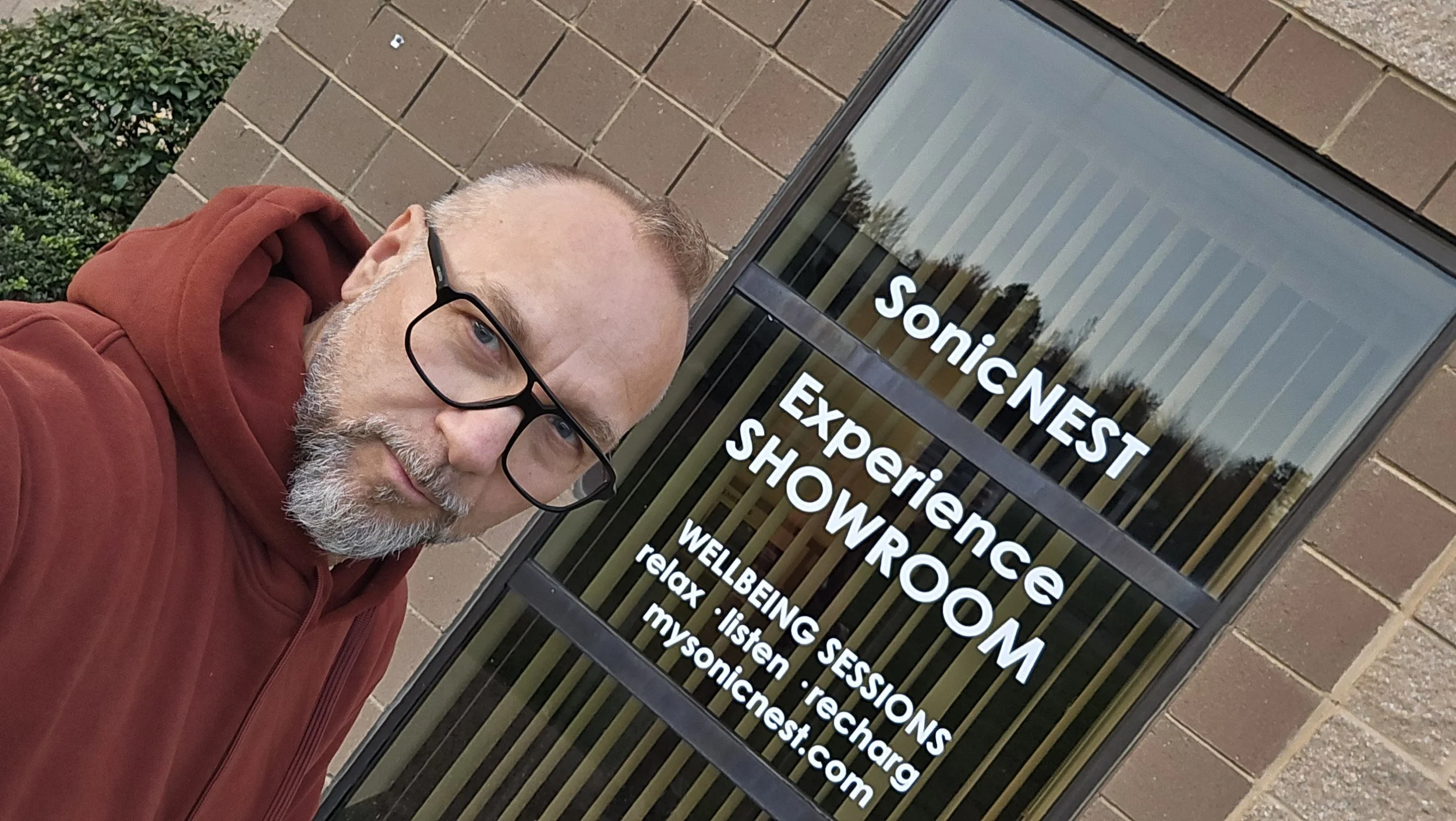 Tomasz Fechter outside the SonicNEST Experience Showroom, announcing its opening as a milestone in the SonicNEST journey.