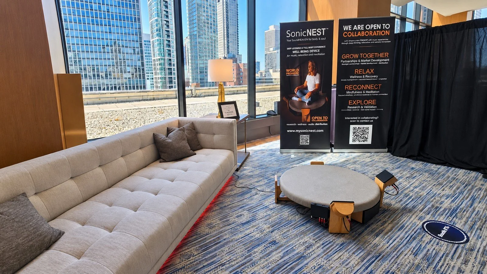 SonicNEST™ world premiere setup inside the Biohackers World Chicago VIP Lounge, arranged as a premium interior for relaxation and immersive listening.