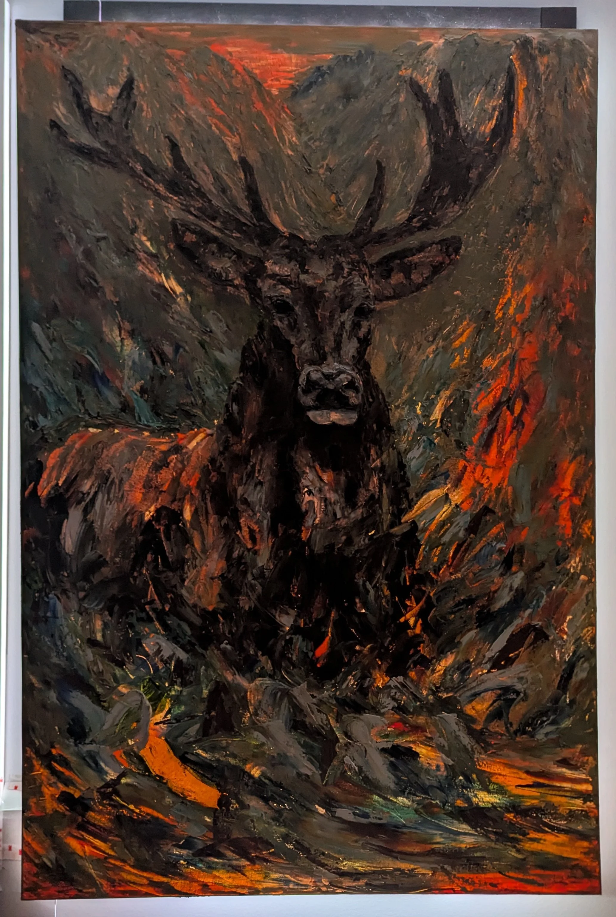 Abstract painting depicting a dark moose with large antlers, set against a background of fiery reds, oranges, and dark earth tones.