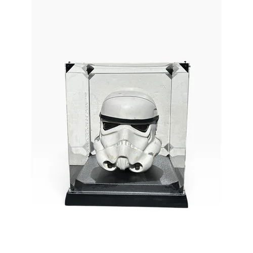 STAR WARS: A NEW HOPE. 1976 PROTOTYPE STORMTROOPER HELMET MADE BY ANDREW AINSWORTH
(Russell’s) ‘Serrated Back’ variant (One of Five in existence), painted vacu-formed plastic, three sectioned, rubber trim brow, clear plastic eyepieces and applied “Bl
