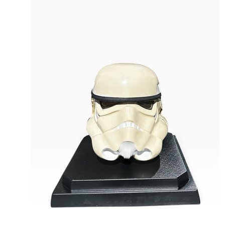 STAR WARS: A NEW HOPE. 1976 PROTOTYPE STORMTROOPER HELMET MADE BY ANDREW AINSWORTH, ‘Serrated Back’ variant (one of five in existence), painted vacu-formed plastic, three sectioned, rubber trim brow and clear plastic eyepieces. Signed & Dated ‘Andrew