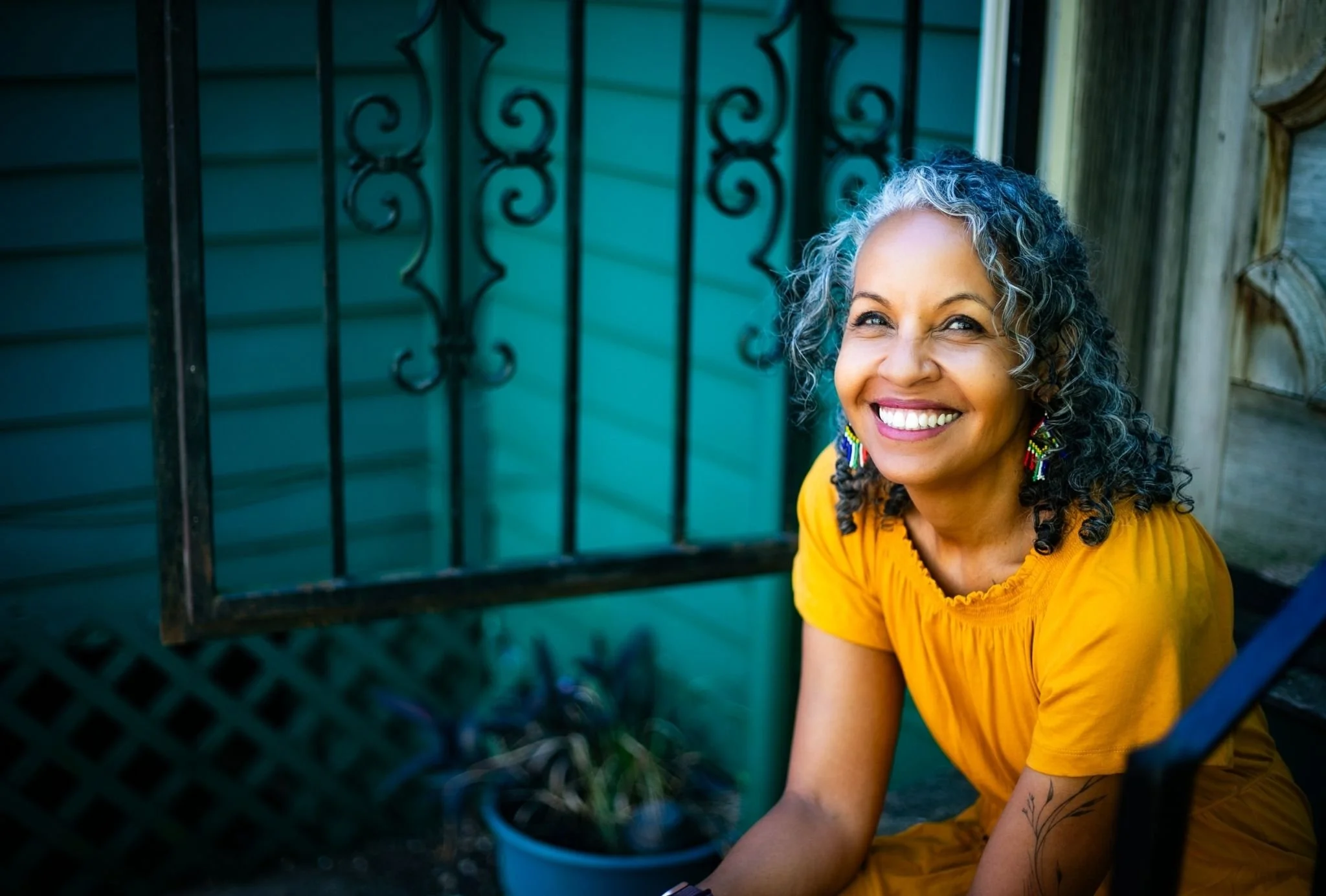 Dr. Michelle Ramos seated outdoors during a women's leadership retreat focused on reflection and growth