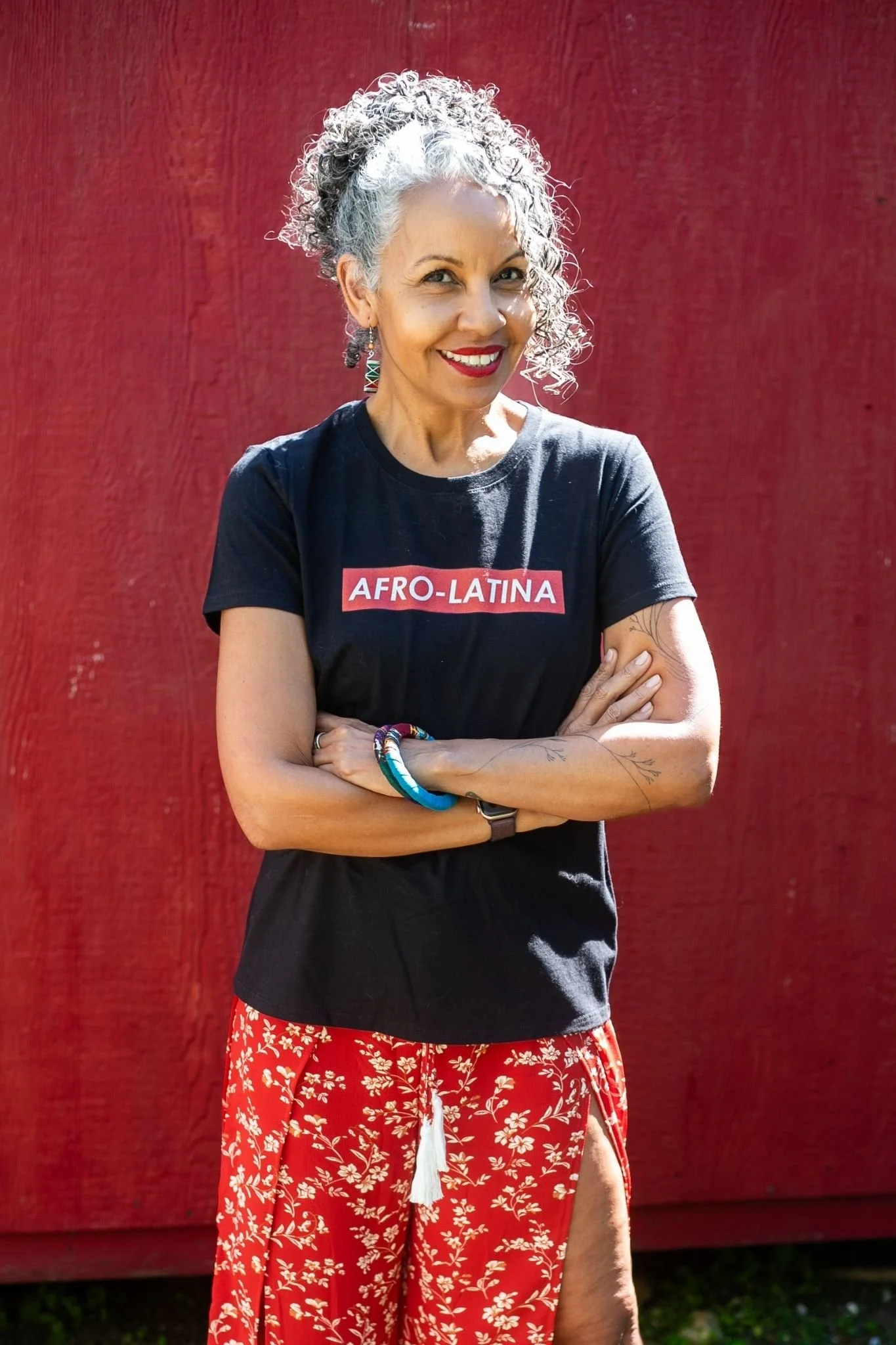 Dr. Michelle Ramos, organizational consultant and leadership strategist, standing confidently outdoors