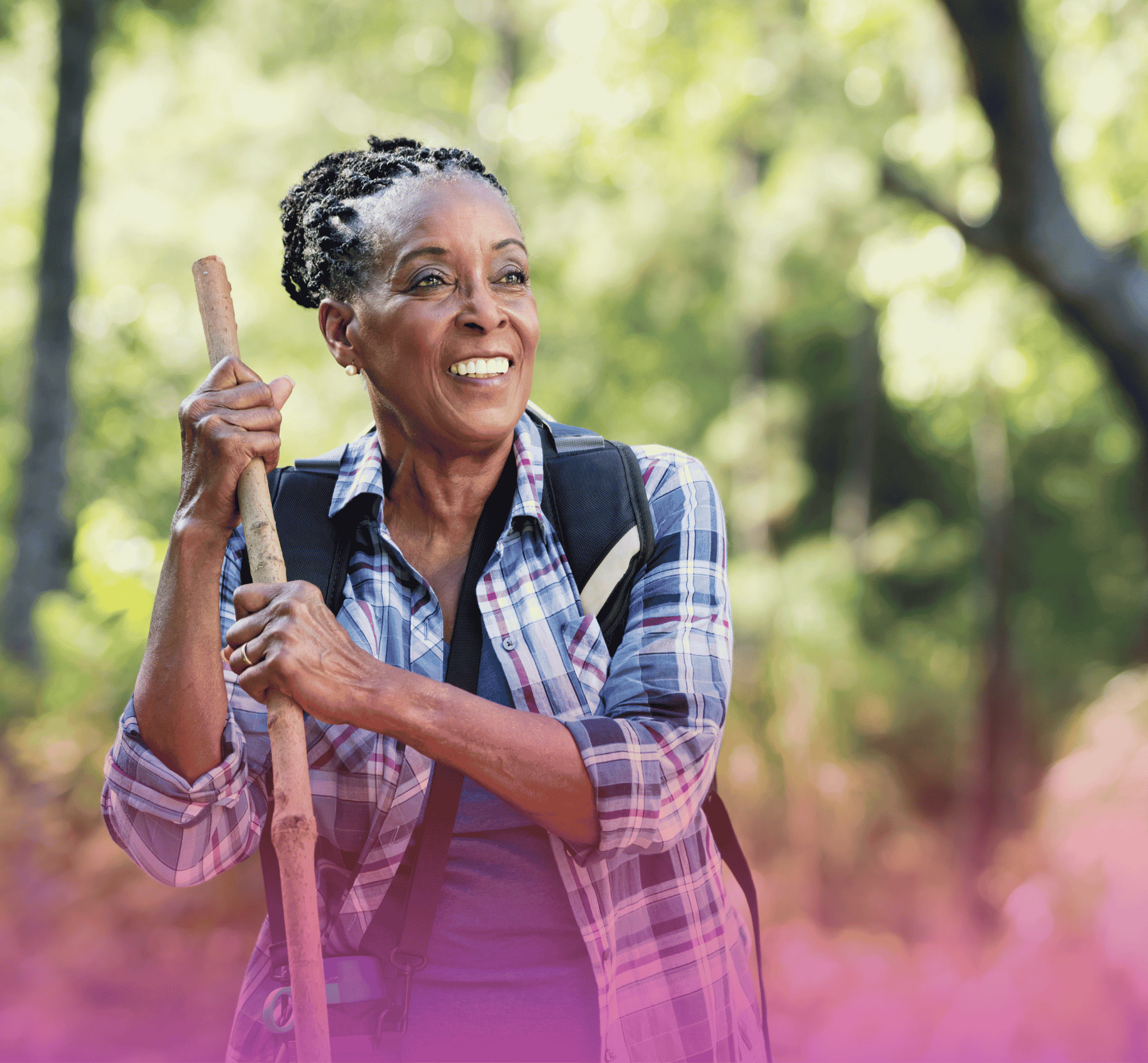 Older woman smiling outdoors while reflecting on retirement and long-term life goals