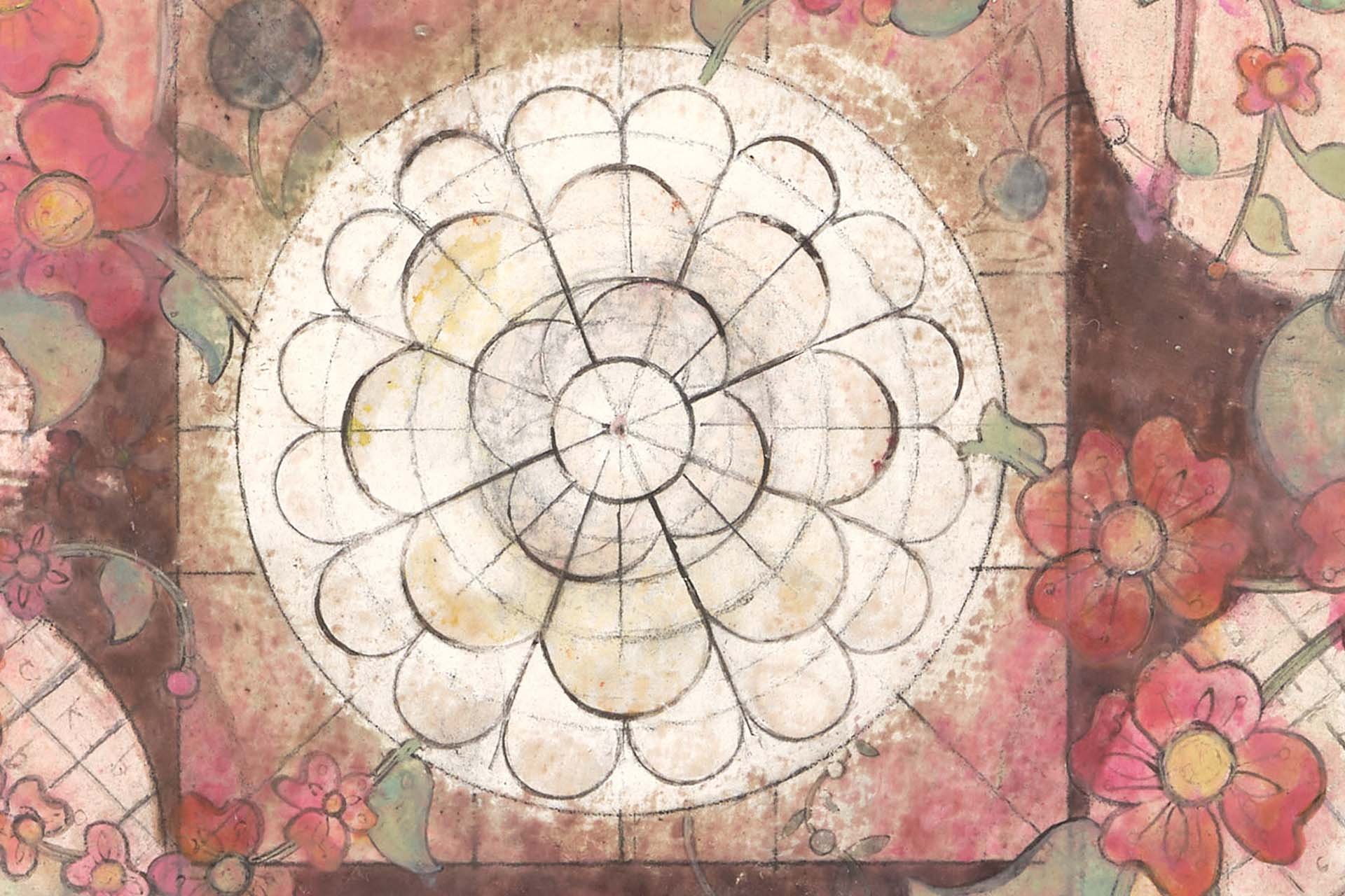 A detailed floral and geometric mural with a central circular pattern surrounded by pink, orange, and green flowers on a weathered, textured background.