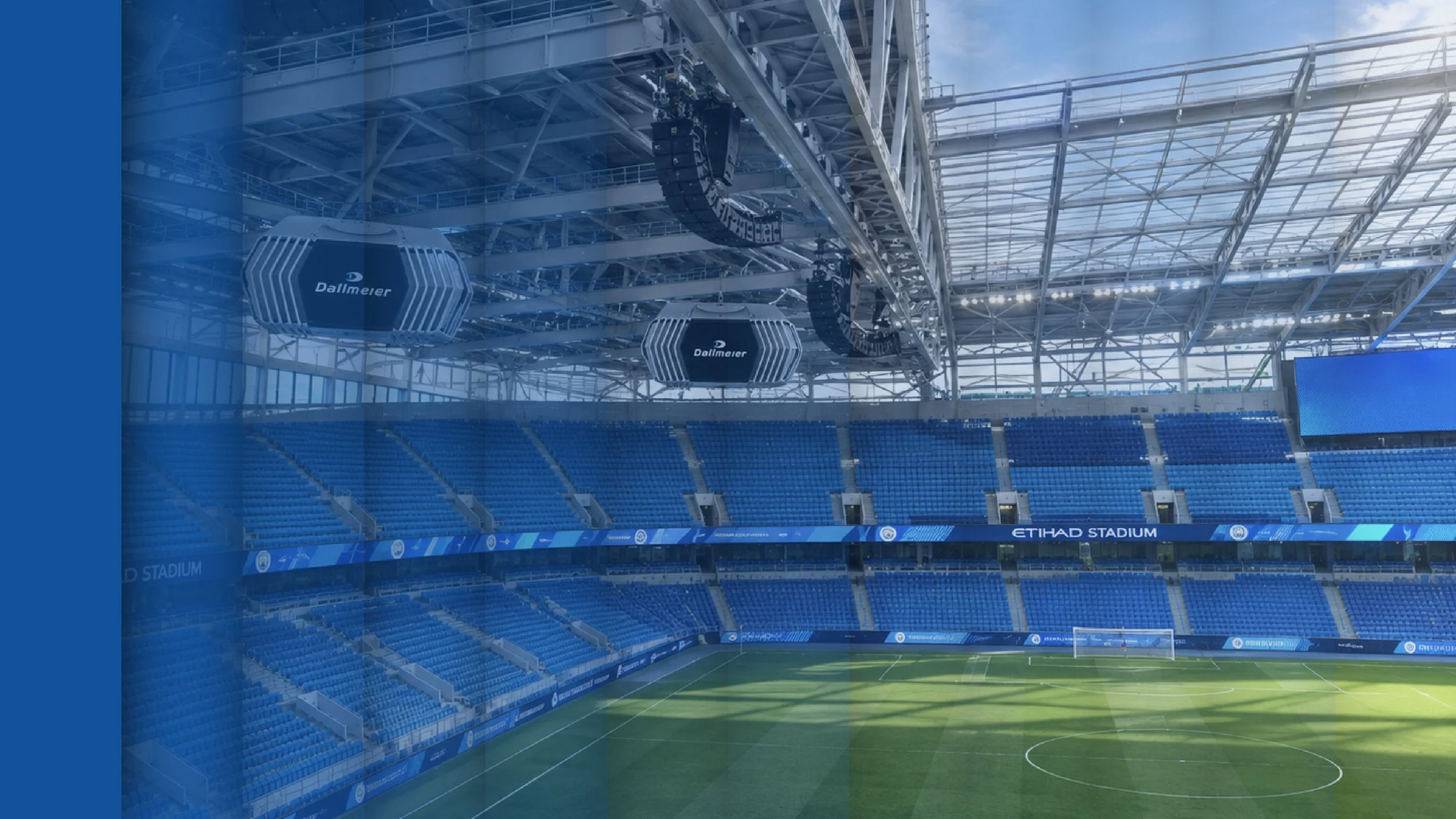 Empty soccer stadium with blue seats, green field, and a large glass roof structure. A panelled effect is layered on top of the image that has a blue gradient travelling from left to right
