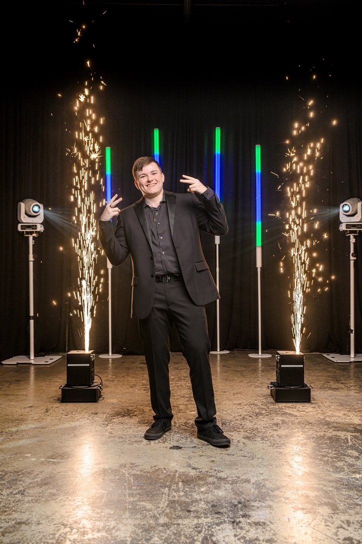 Blake Hauser between two cold-spark fountains