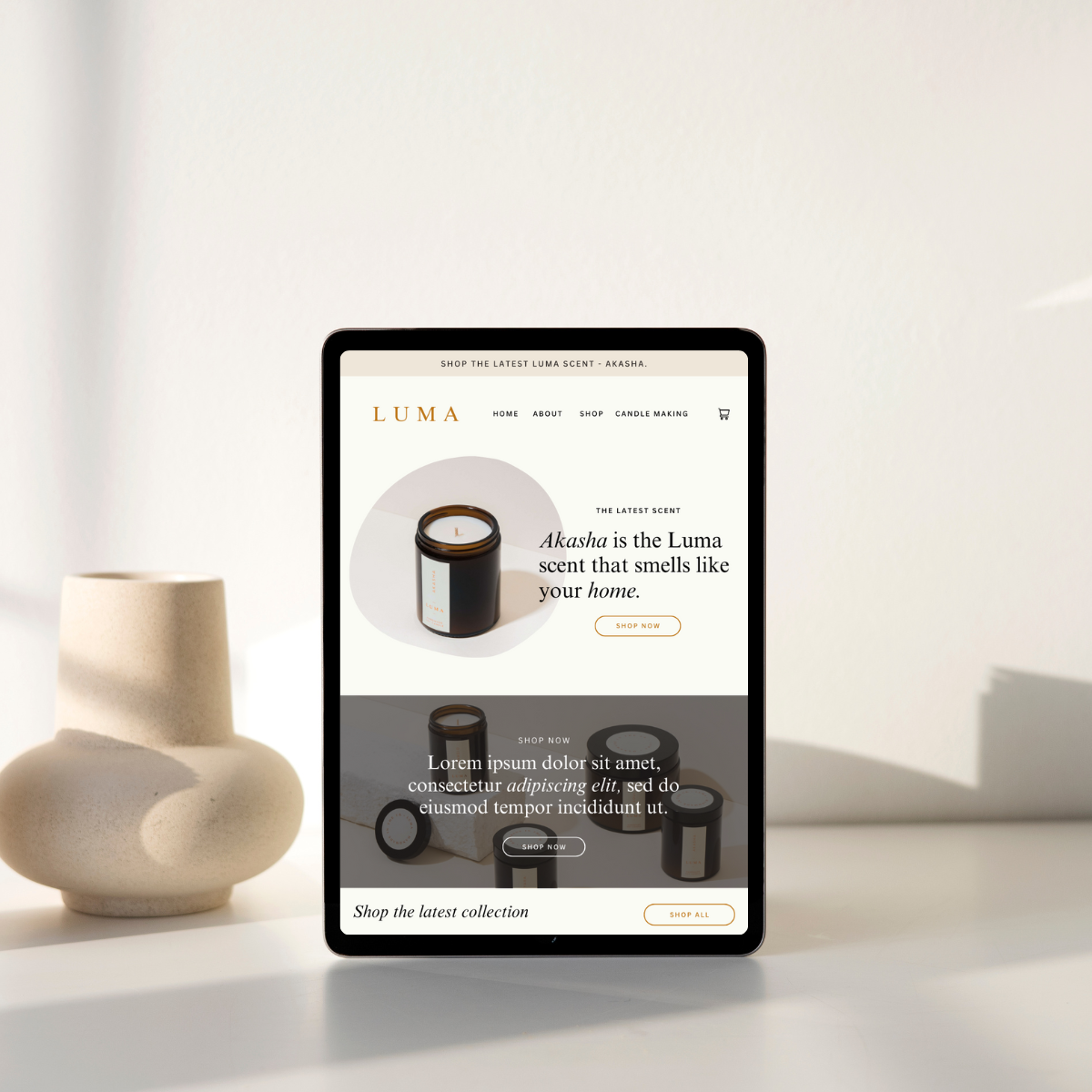 Digital tablet displaying an online store for candles and scents, with a minimalistic design and neutral-colored decor in the background.