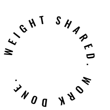 Silhouette of a person doing a handstand on the beach with an ocean and sky background.