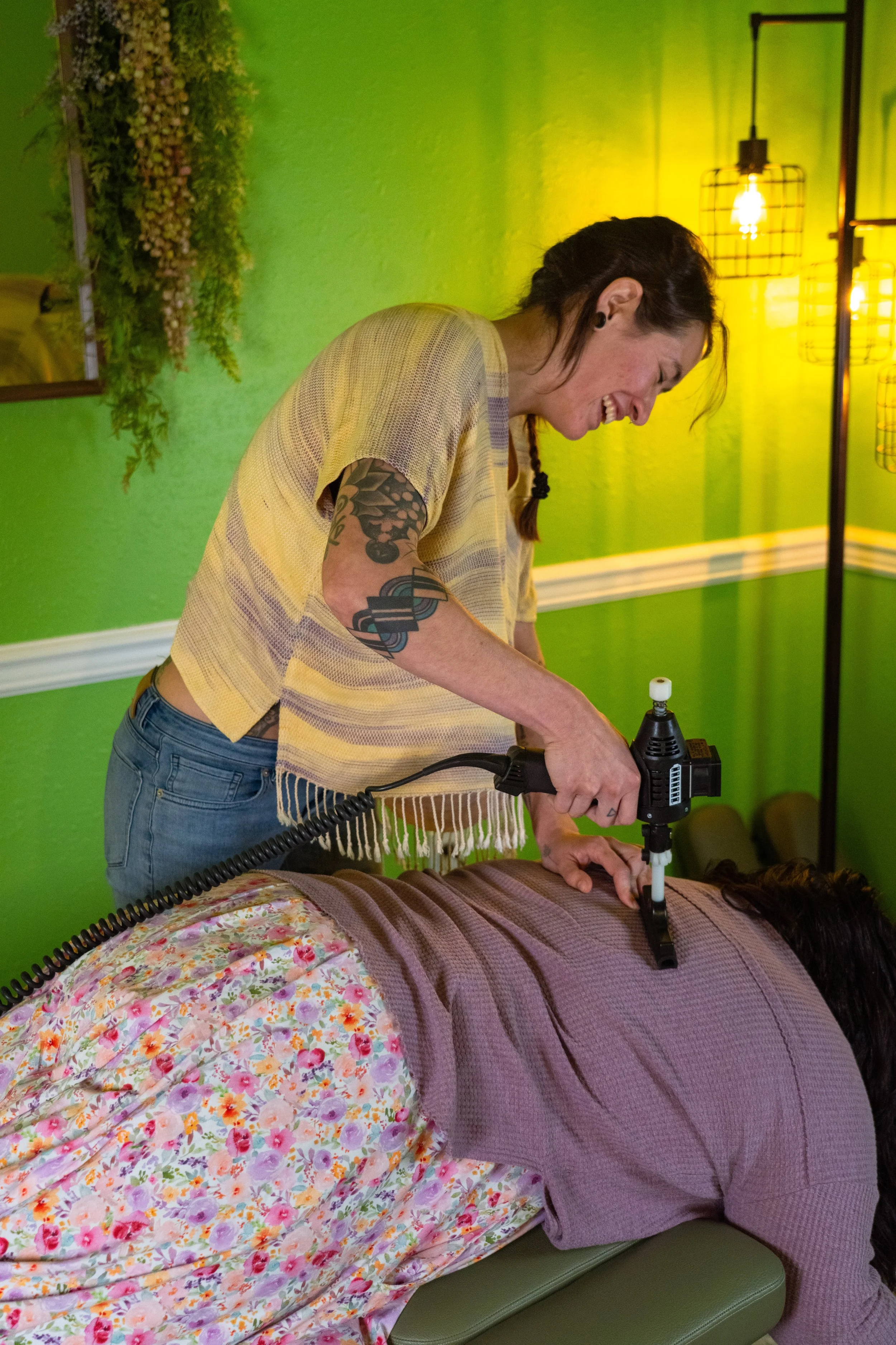 Dr. Lacy adjusting a pregnant woman with arthrostim - Vancouver, WA