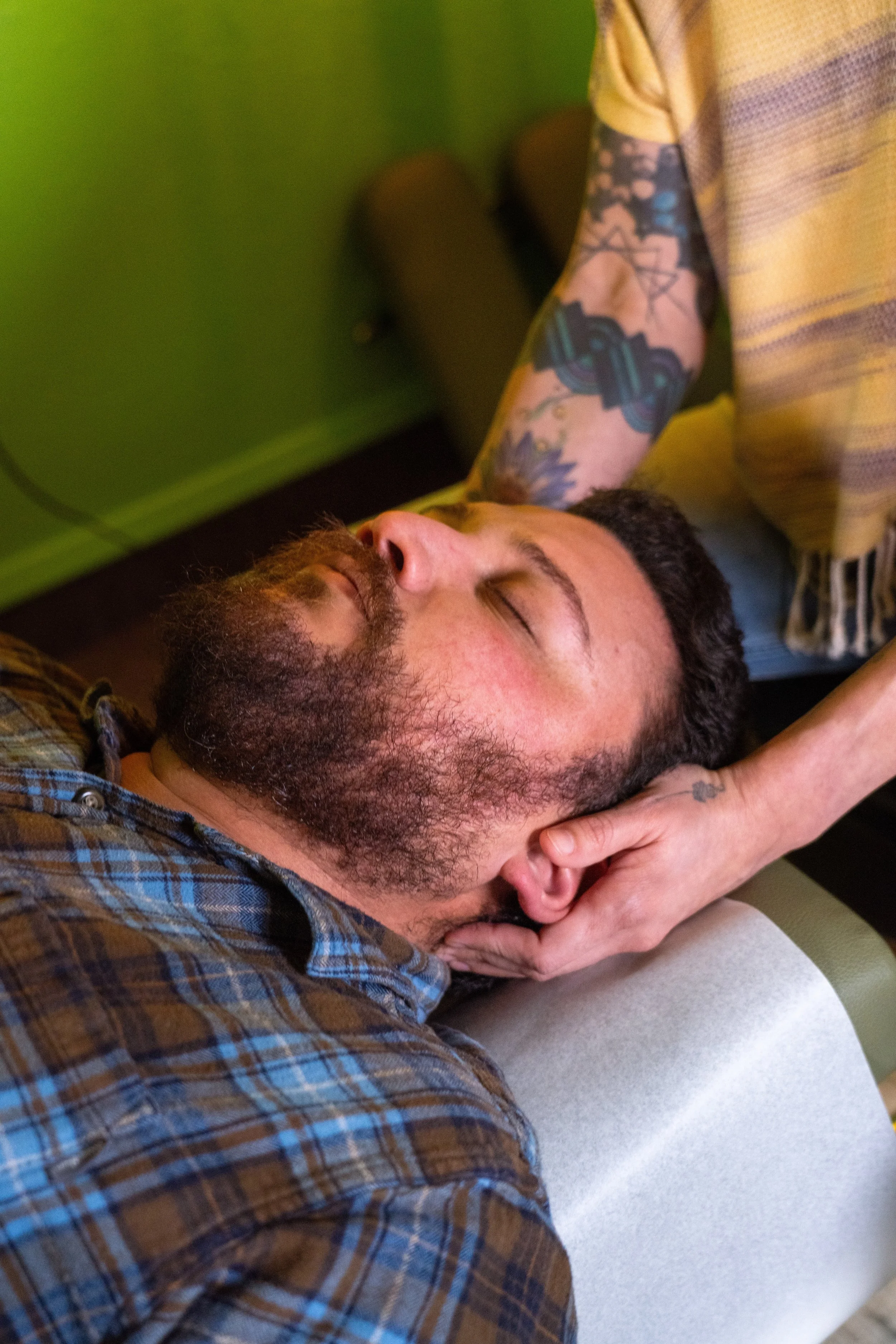 Dr. Lacy adjusting a man's neck - Vancouver, WA