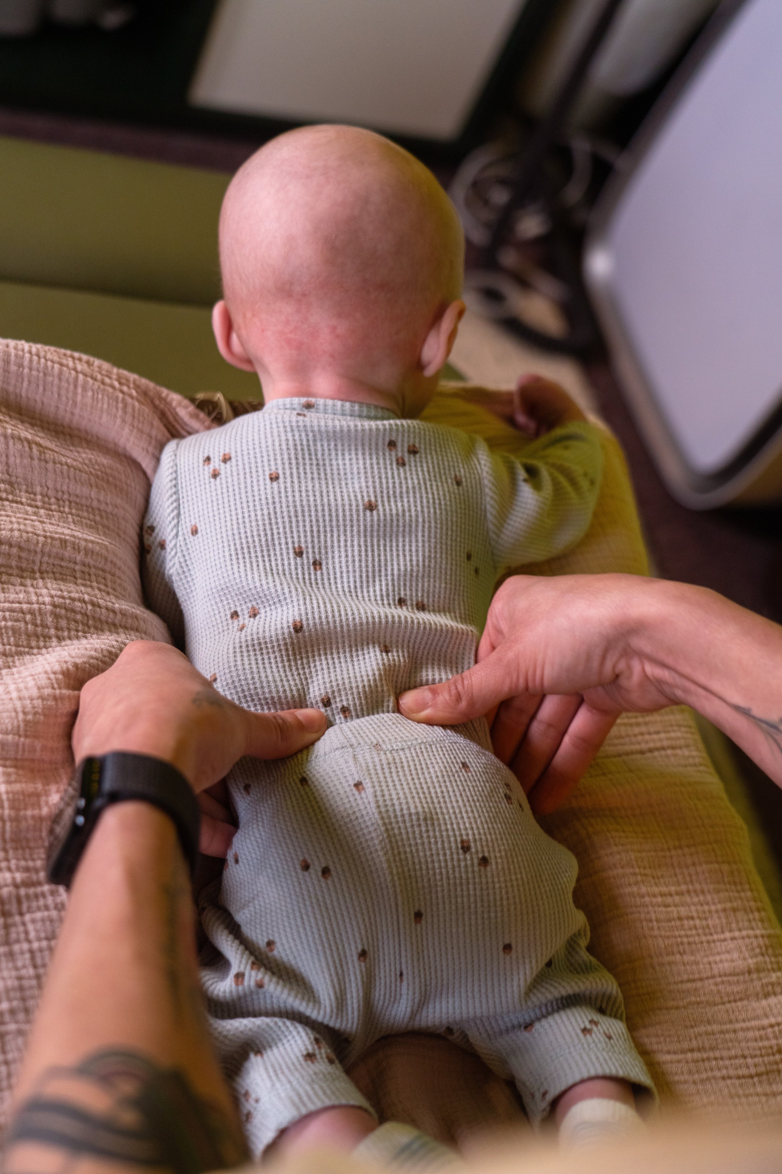 Dr. Lacy adjusting a baby - Vancouver, WA