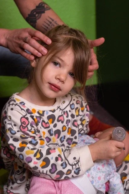 Dr. Lacy doing cranial work on a little girl - Vancouver, WA