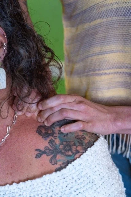 Dr. Lacy doing massage on a woman's shoulder - Vancouver, WA