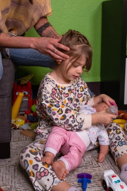 Dr. Lacy adjusting a little girl - Vancouver, WA