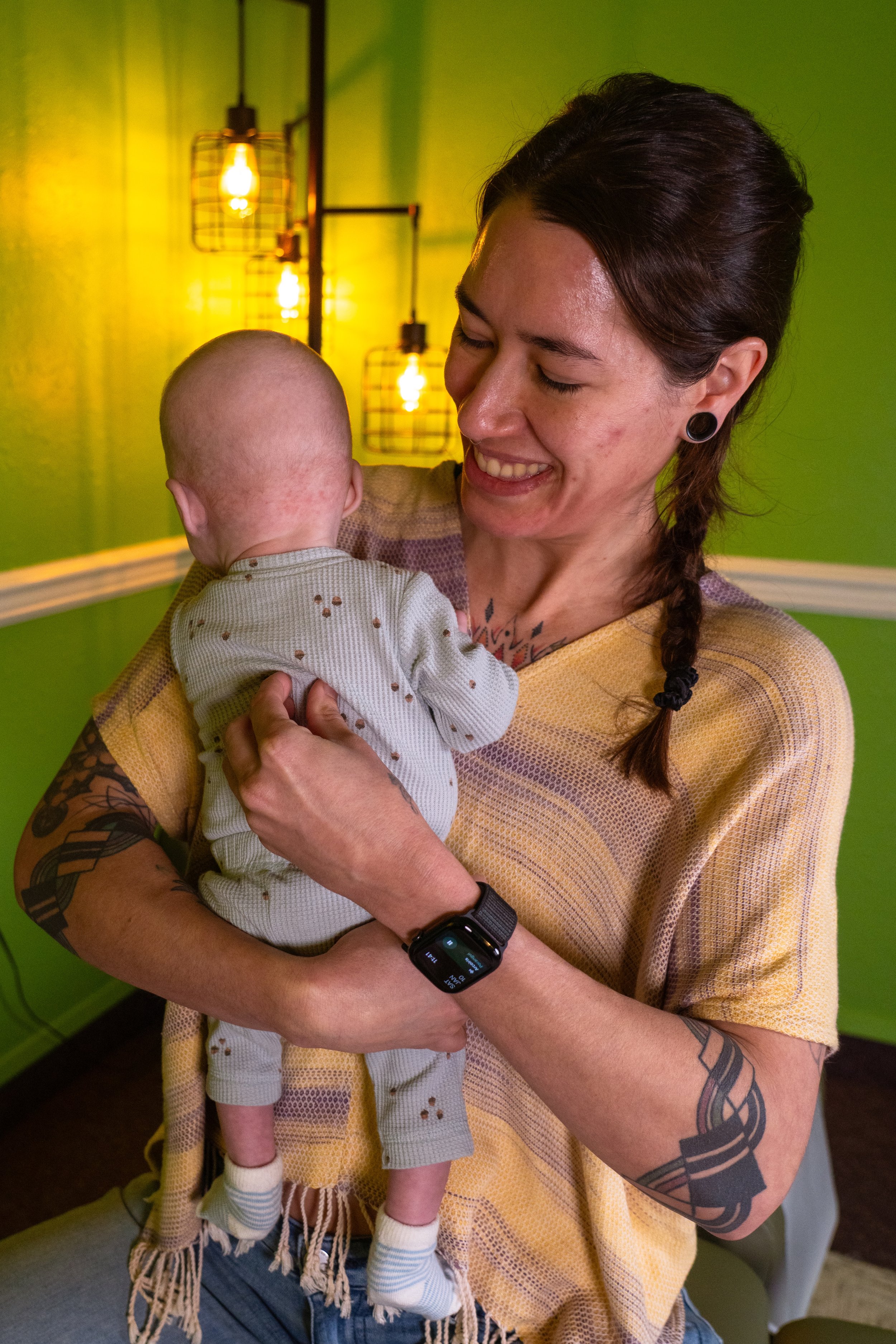 Dr. Lacy holding and adjusting a baby - Vancouver, WA