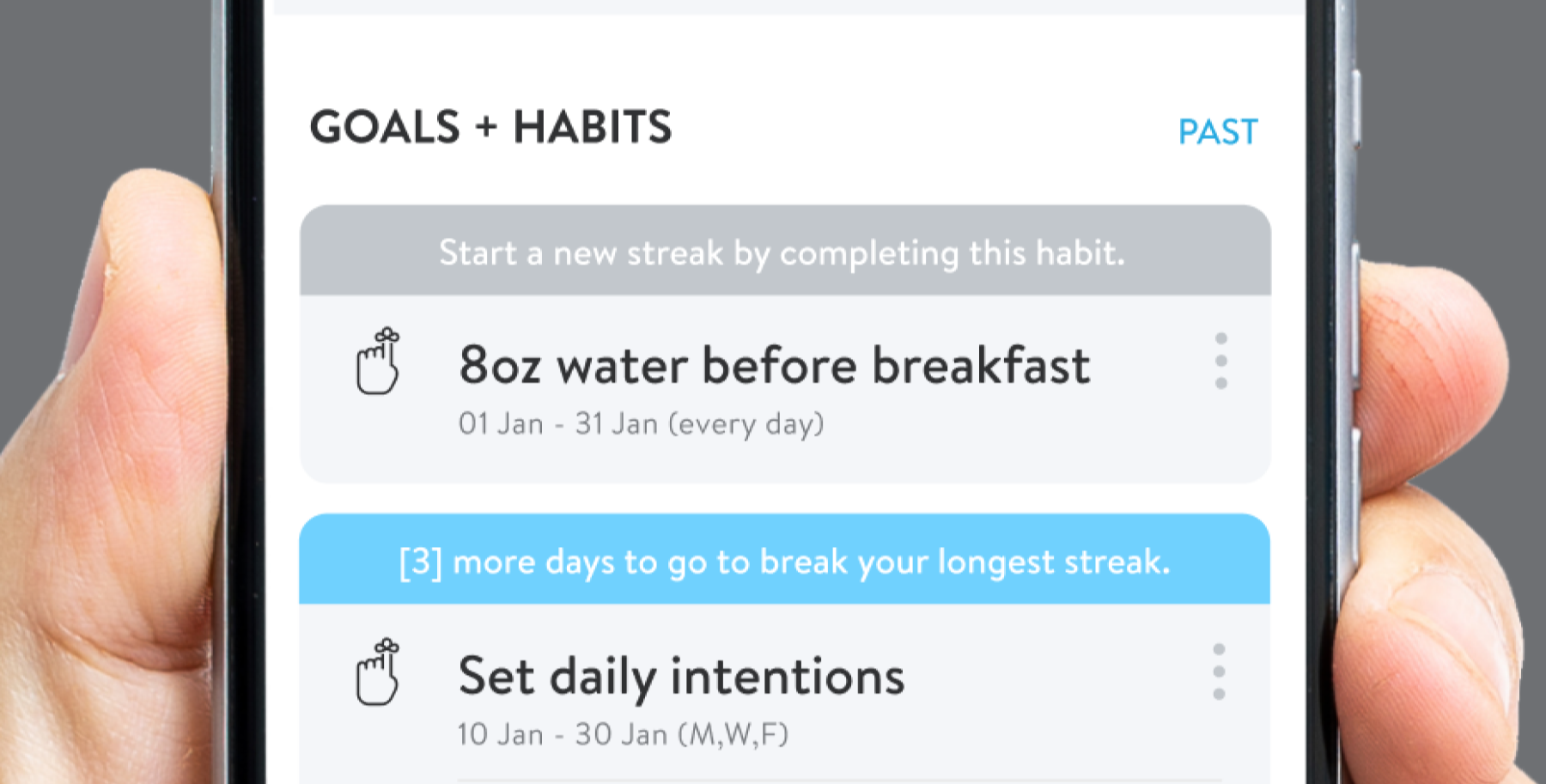 Smartphone screen displaying a habit tracking app for goals and habits, with a focus on an entry to drink 8 ounces of water before breakfast every day in January.