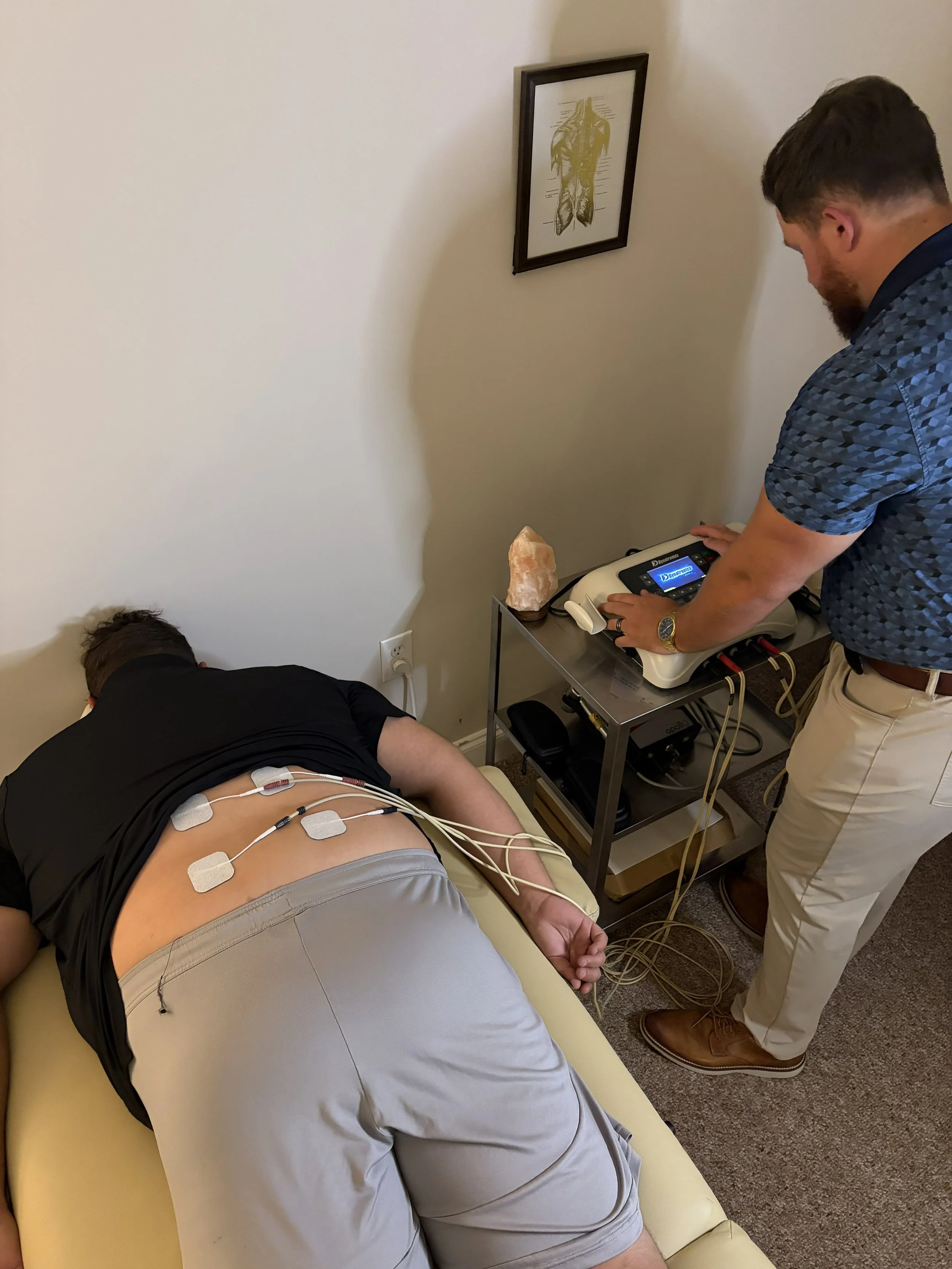 Electrical stimulation therapy for lower back treatment at Addison Chiropractic & Sports Clinic, Kennesaw GA
