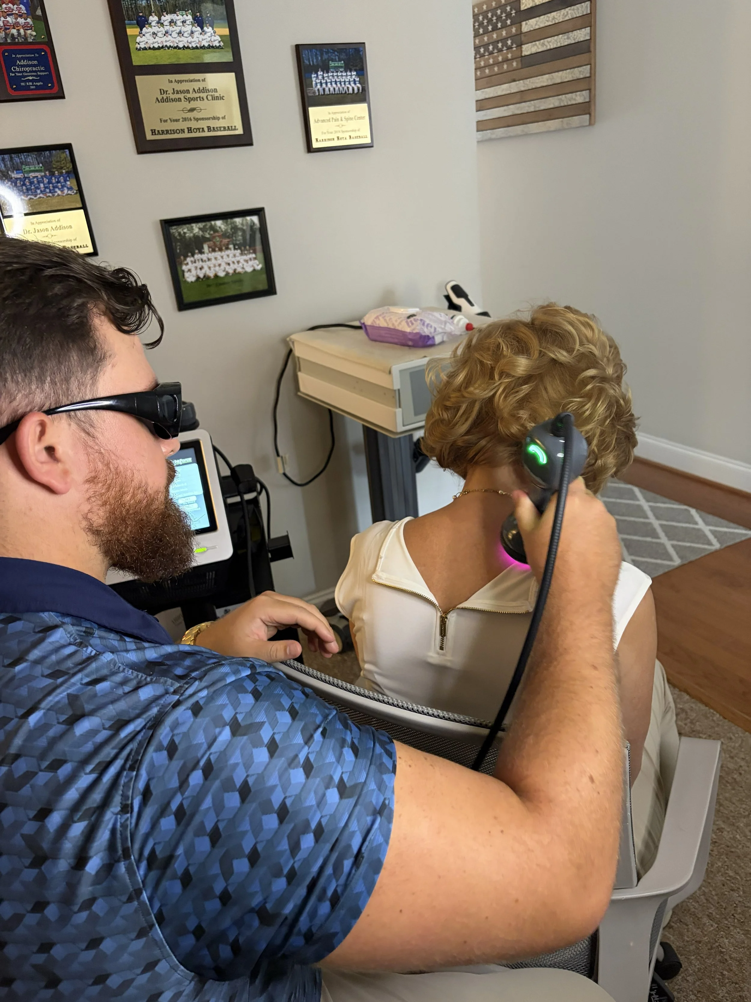 Cold laser therapy for neck treatment at Addison Chiropractic & Sports Clinic, Kennesaw GA.