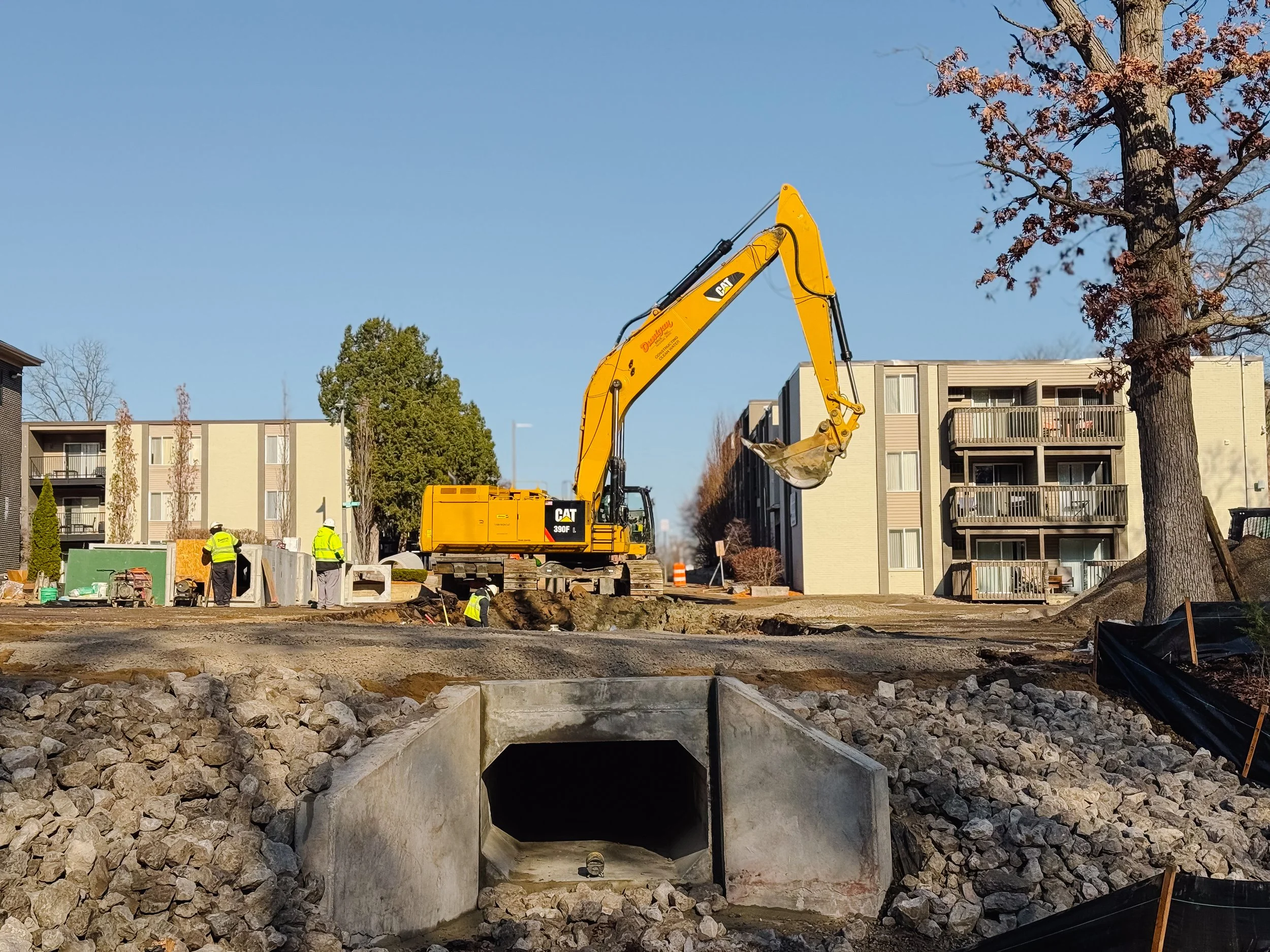 Dunigan Bros. active construction site with workers and excavator