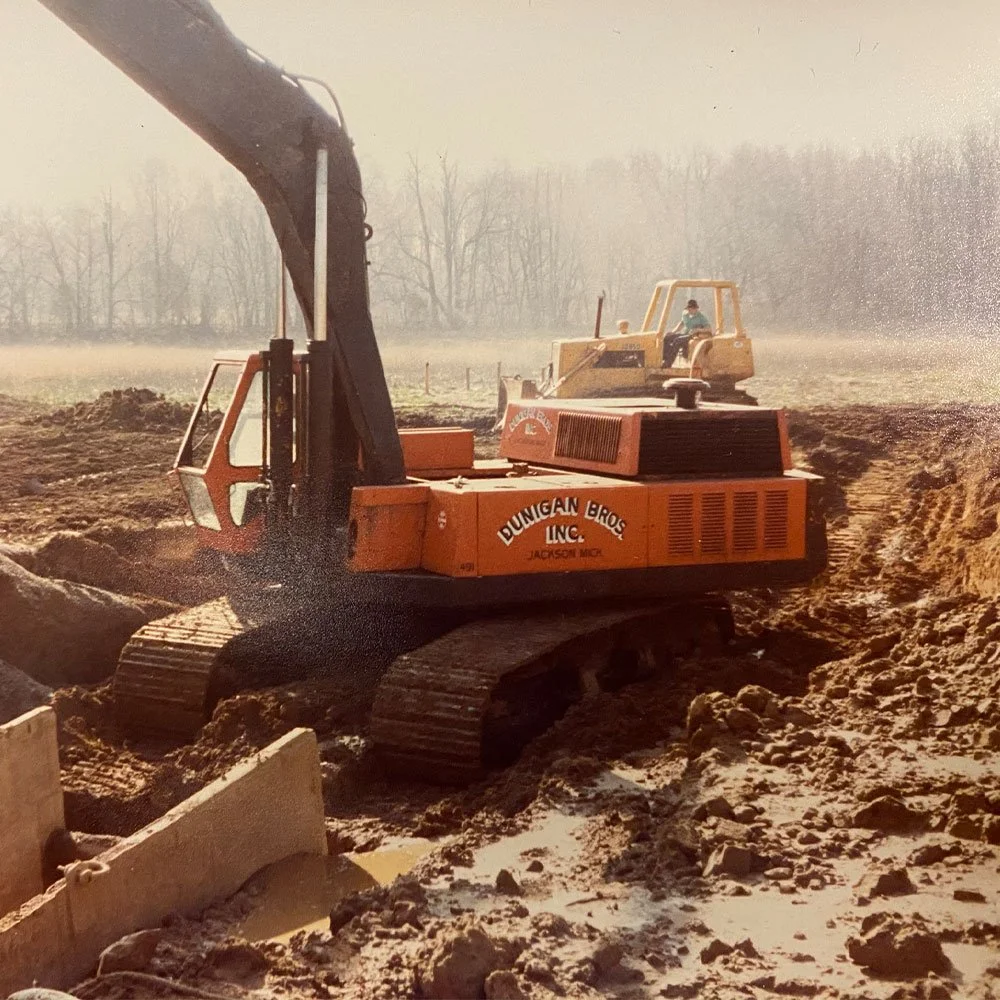 Historical photo of Dunigan Bros. excavator on an construction site