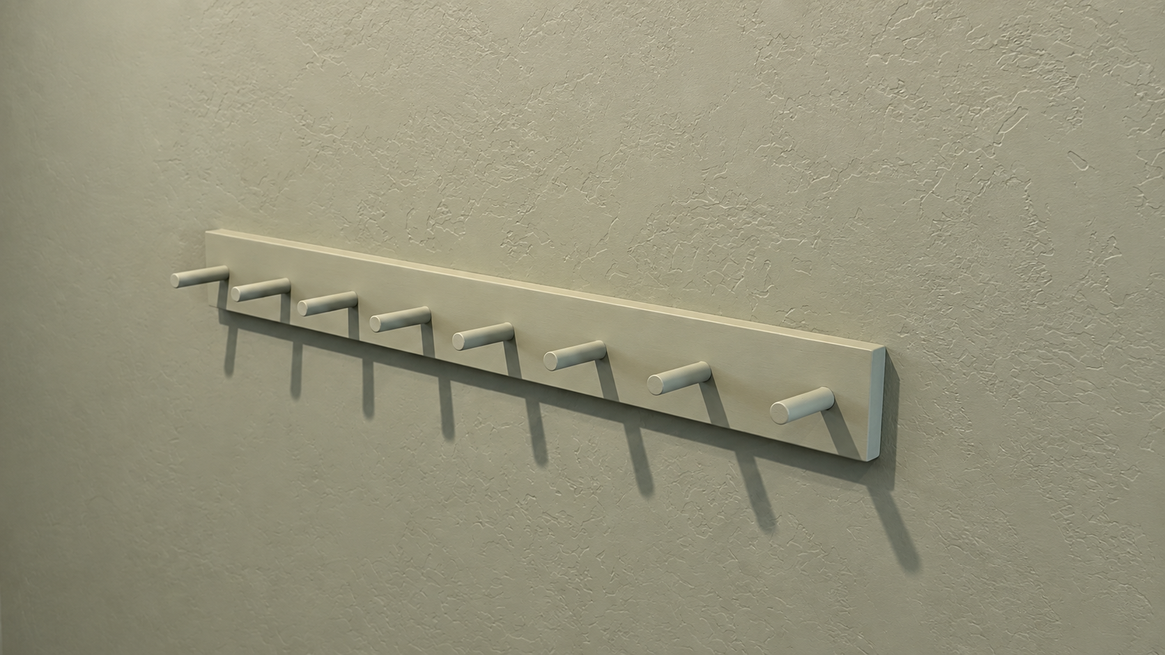 Angled view of a custom eight-peg wood rack mounted flush against the wall.