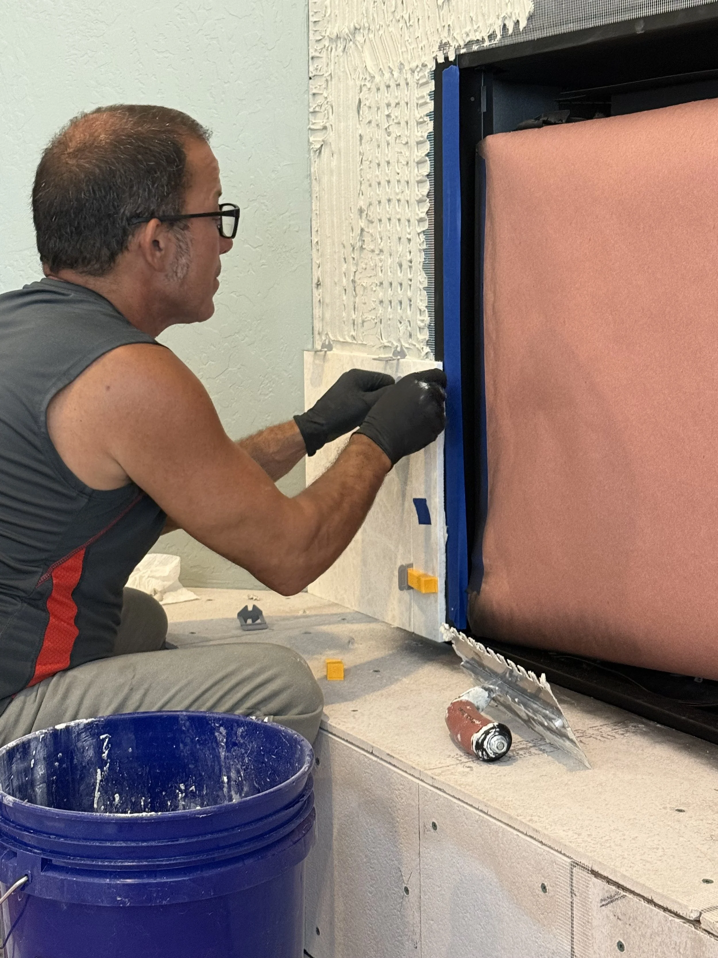 Don of Solid Ground Tile Co. working on a custom tile installation