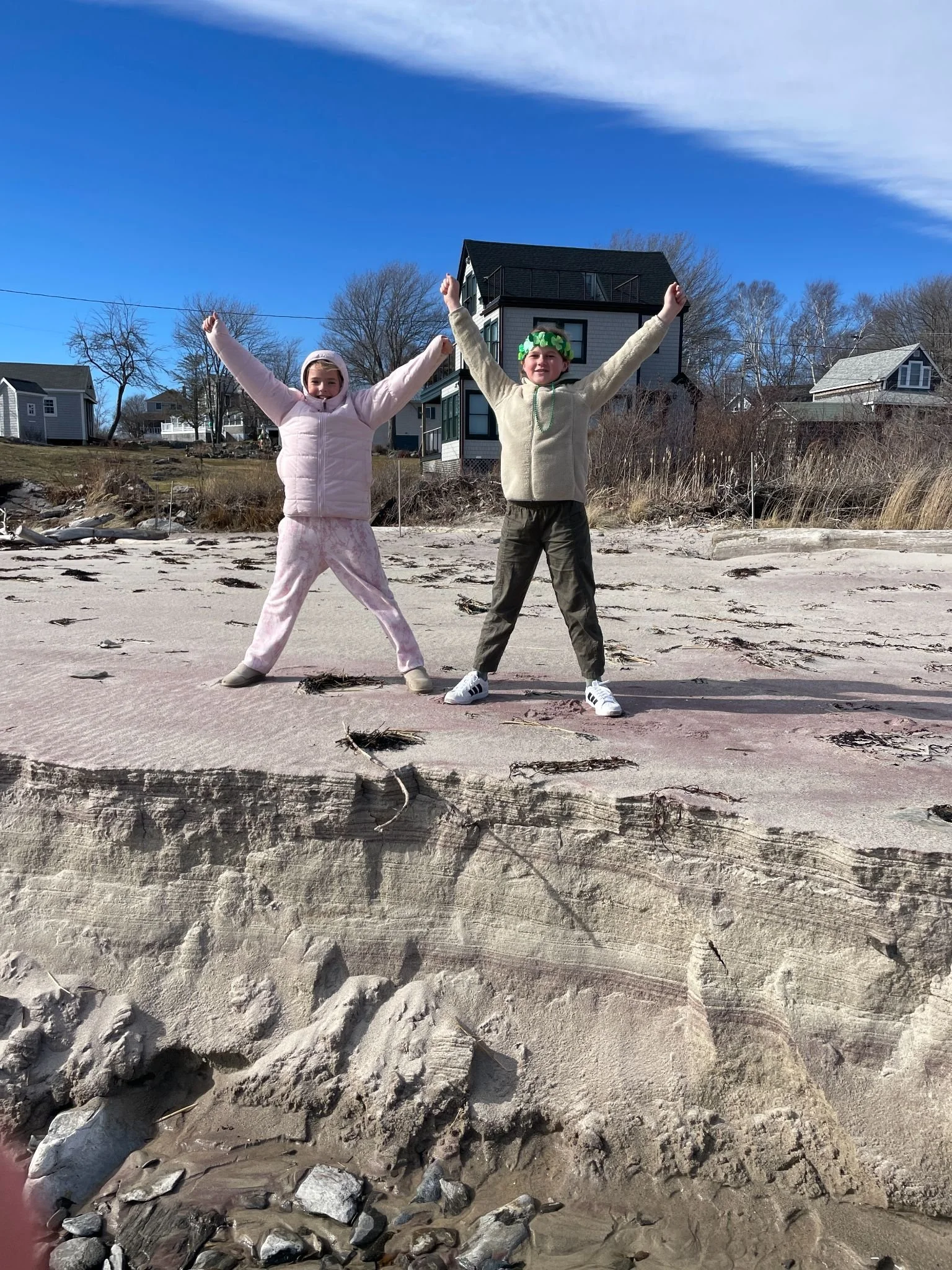 students engaged in place-based learning about erosion at a beach