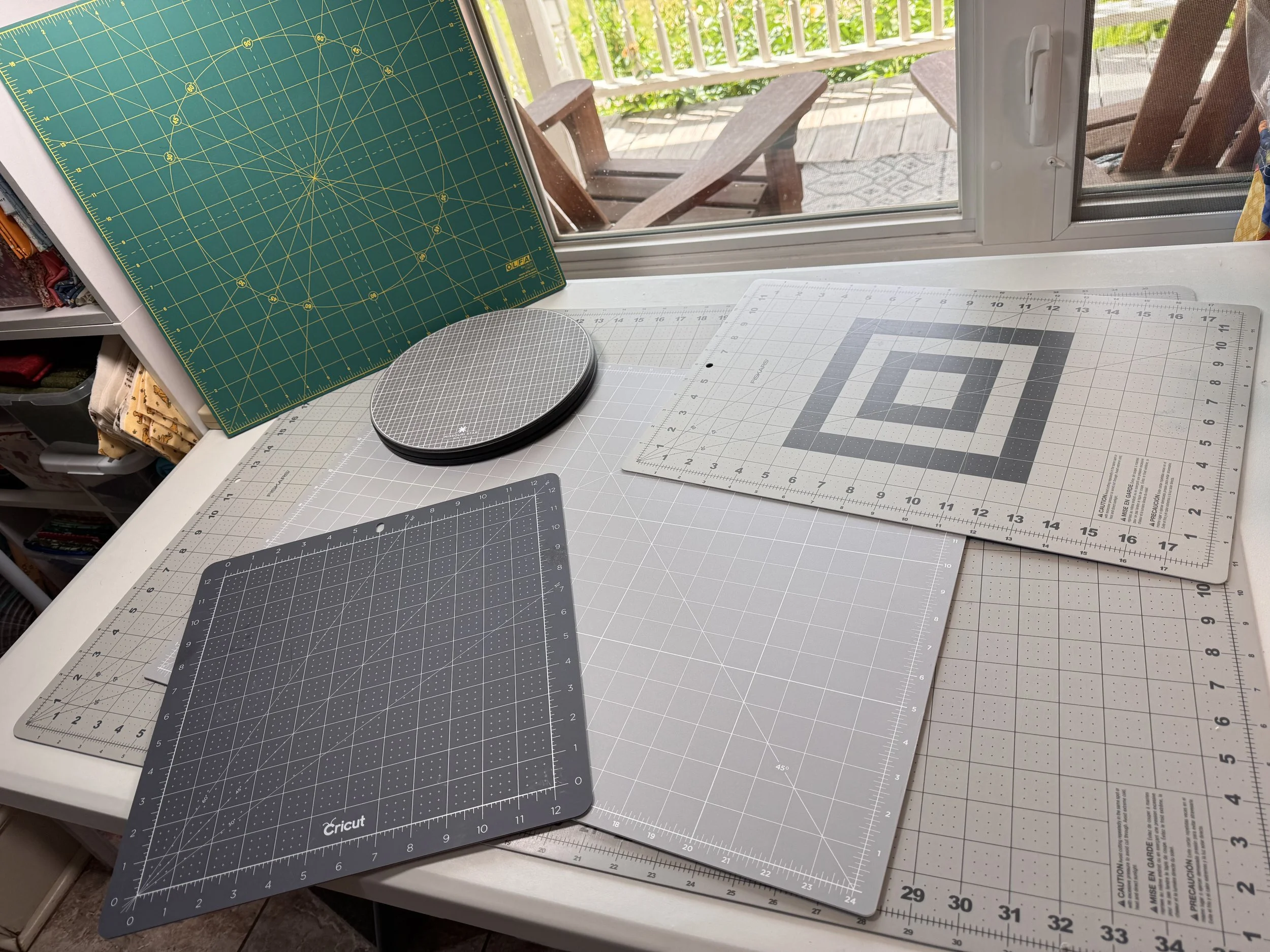 cutting mats and tools used for sewing and quilting