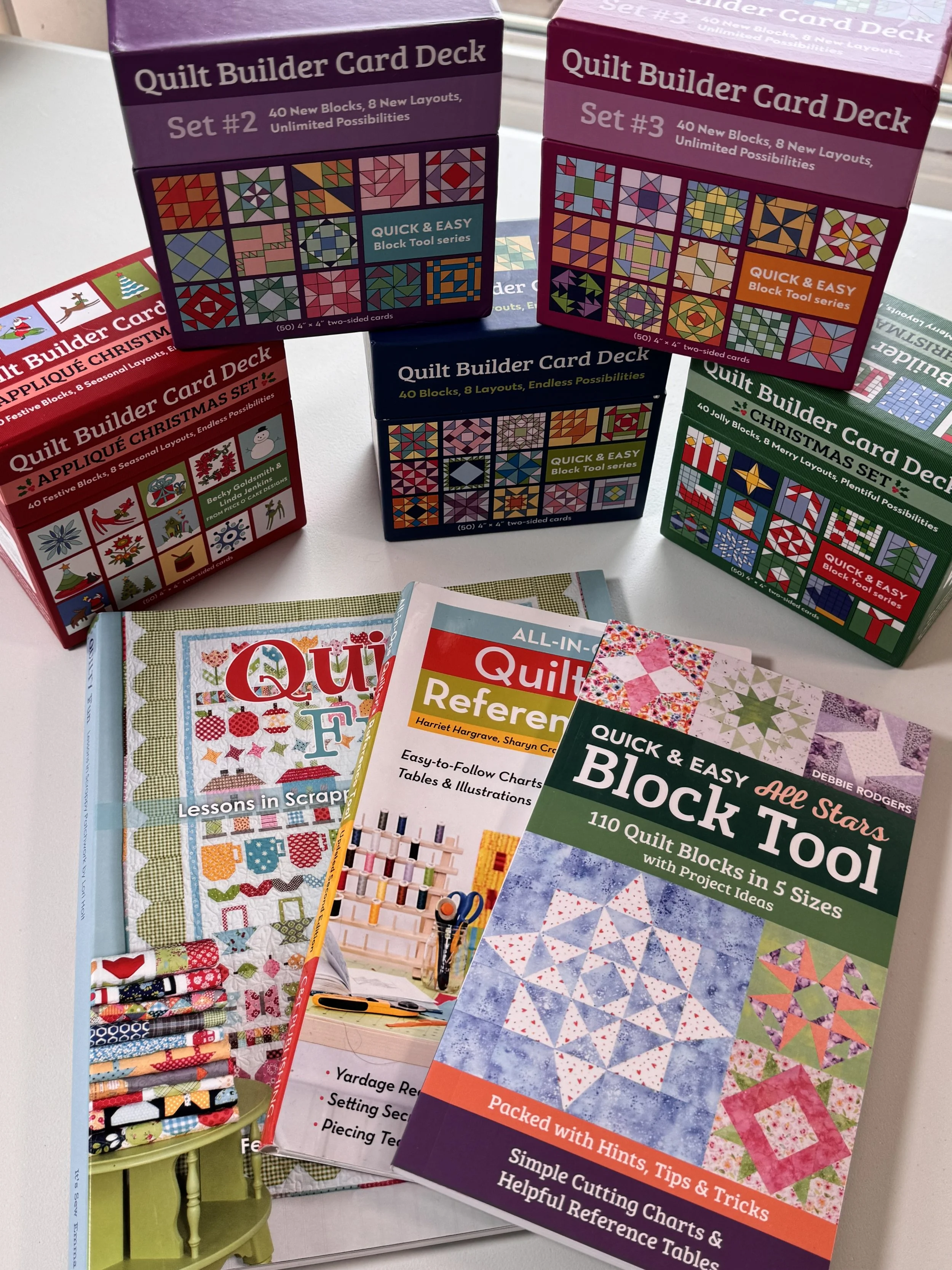 Collection of sewing and quilting books, patterns, and educational resources.