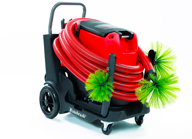 Red commercial vacuum cleaner with a long hose and green cleaning brushes attached, on a black wheeled cart.