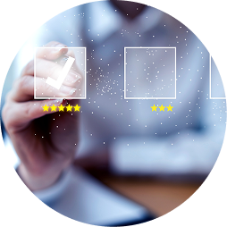 Person in the background interacting with a transparent touchscreen interface, selecting a white box with five yellow stars underneath. The screen has multiple empty squares, with one filled with a hand icon.