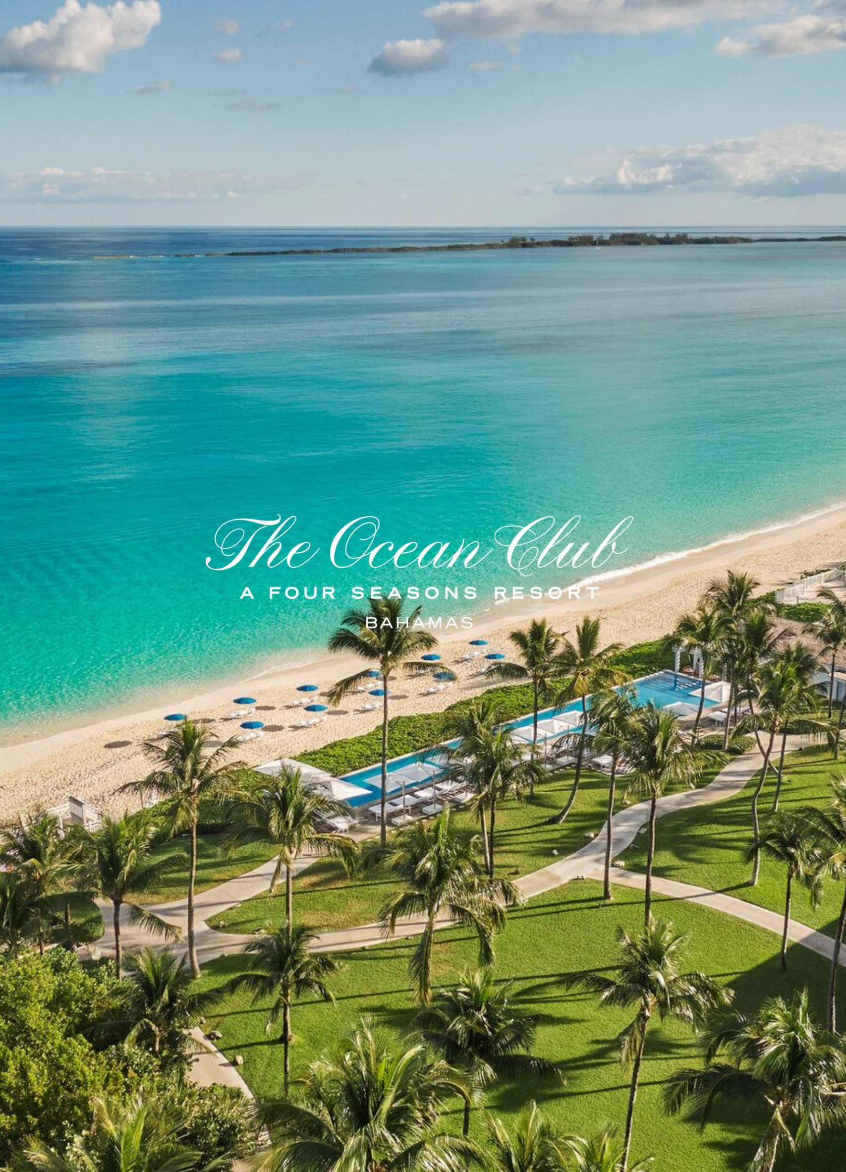 Aerial view of a tropical beach resort with turquoise water, sandy shoreline, palm trees, and a swimming pool area. The image includes a label reading 'The Ocean Club' and 'A Four Seasons Resort Bahamas'.