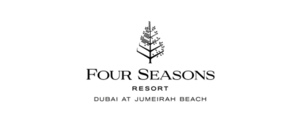 Four Seasons Resort Dubai at Jumeirah Beach logo with a palm tree icon.